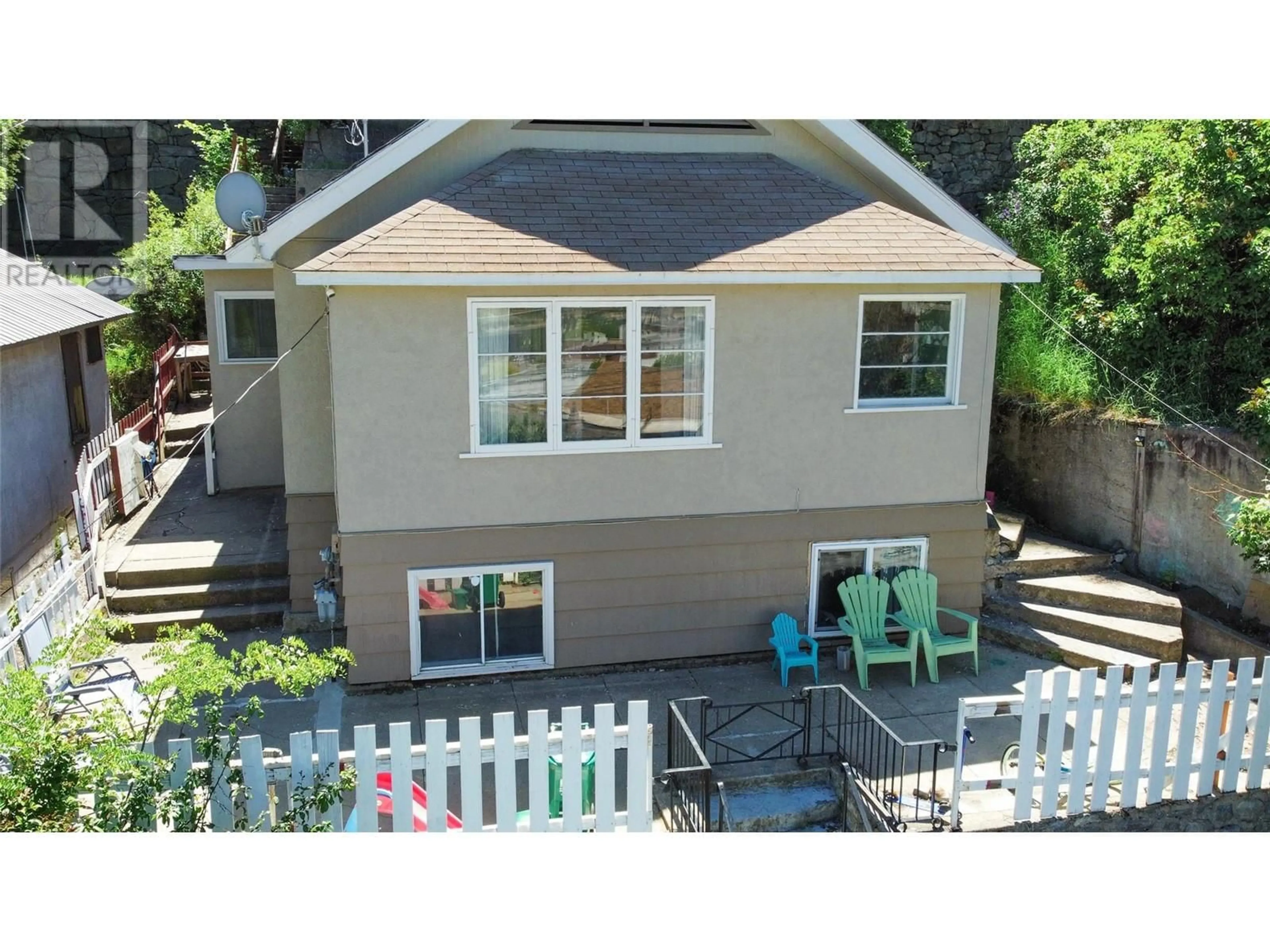 Home with vinyl exterior material, street for 1730 TOPPING STREET, Trail British Columbia V1R4G3