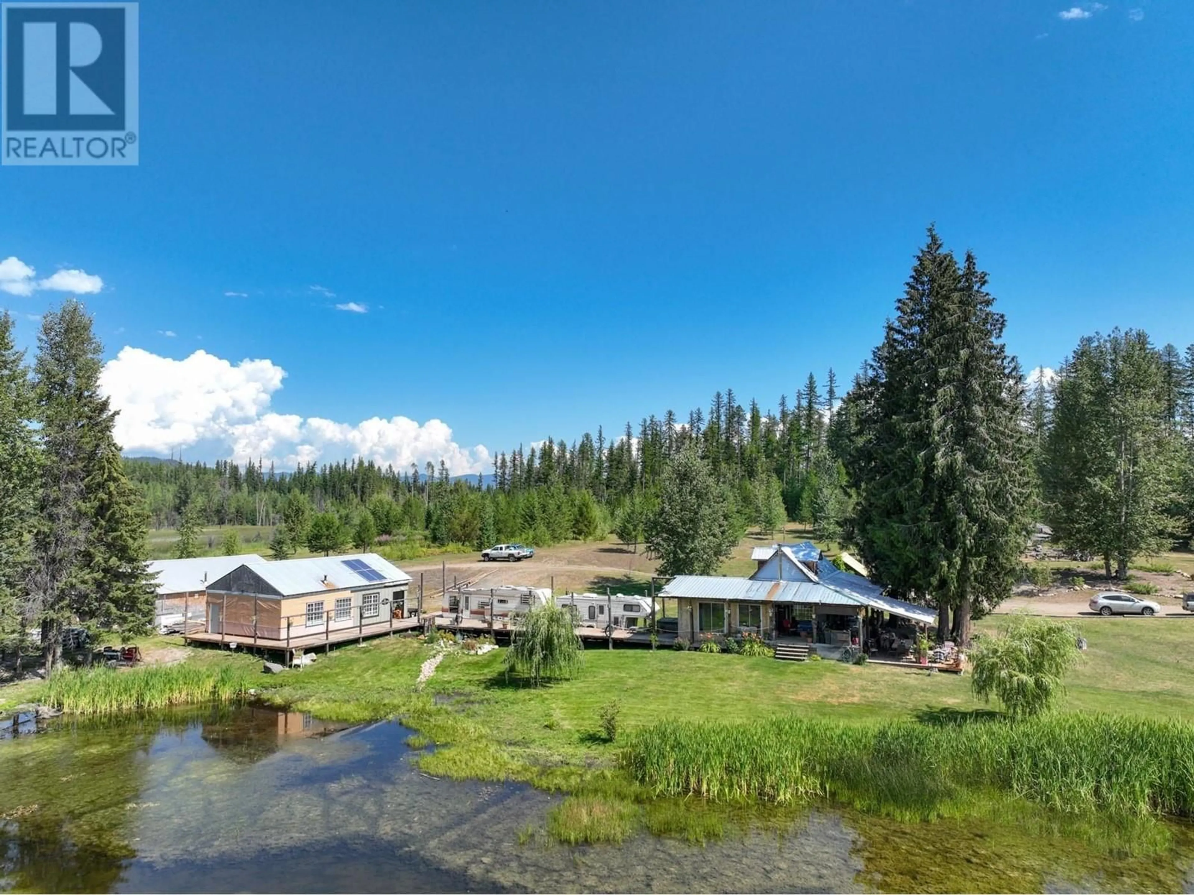 A pic from outside/outdoor area/front of a property/back of a property/a pic from drone, water/lake/river/ocean view for 650 TRINITY VALLEY ROAD, Lumby British Columbia V0E2G4