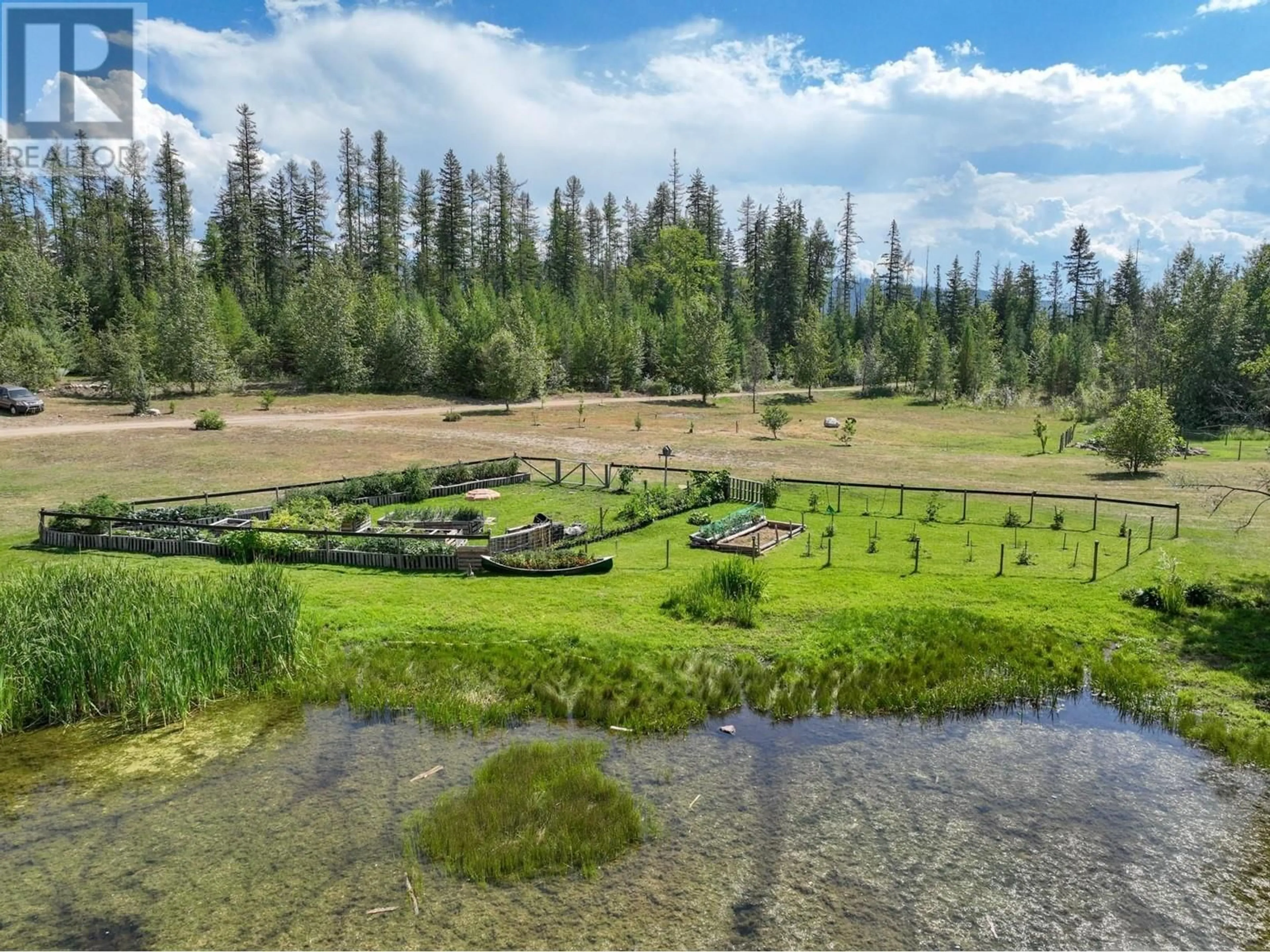 A pic from outside/outdoor area/front of a property/back of a property/a pic from drone, water/lake/river/ocean view for 650 TRINITY VALLEY ROAD, Lumby British Columbia V0E2G4