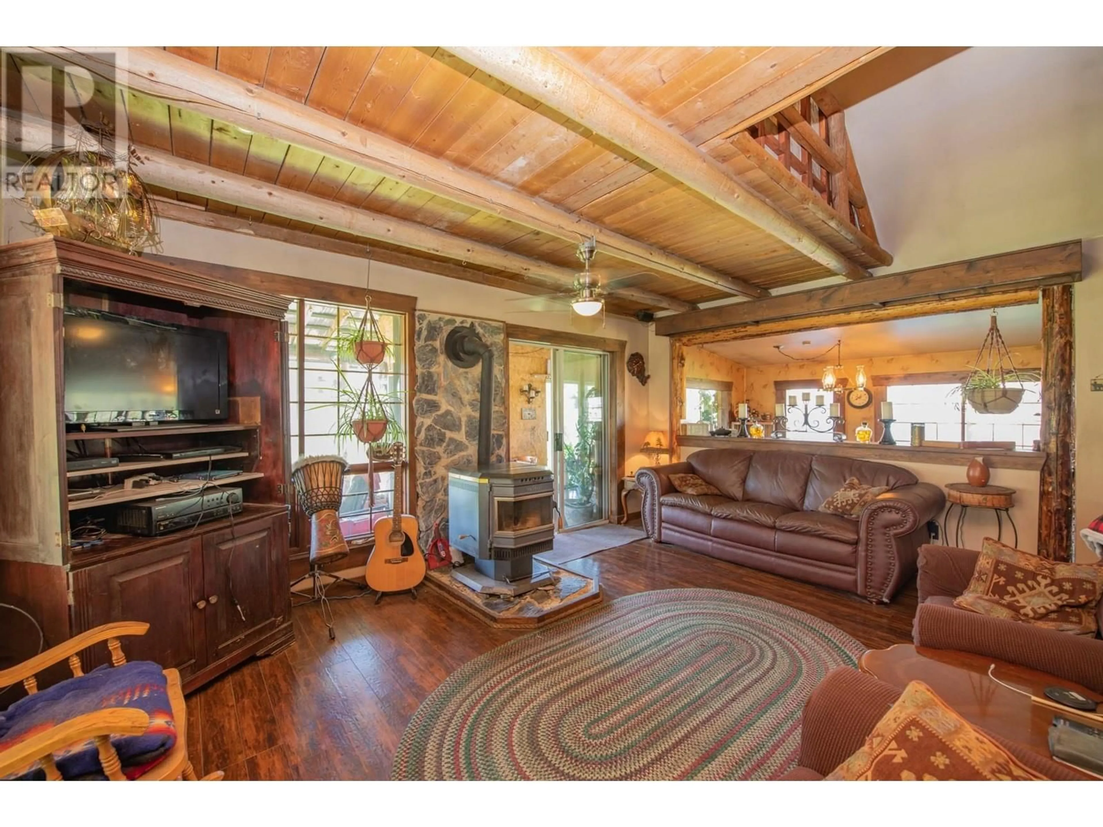 Living room with furniture, wood/laminate floor for 650 TRINITY VALLEY ROAD, Lumby British Columbia V0E2G4