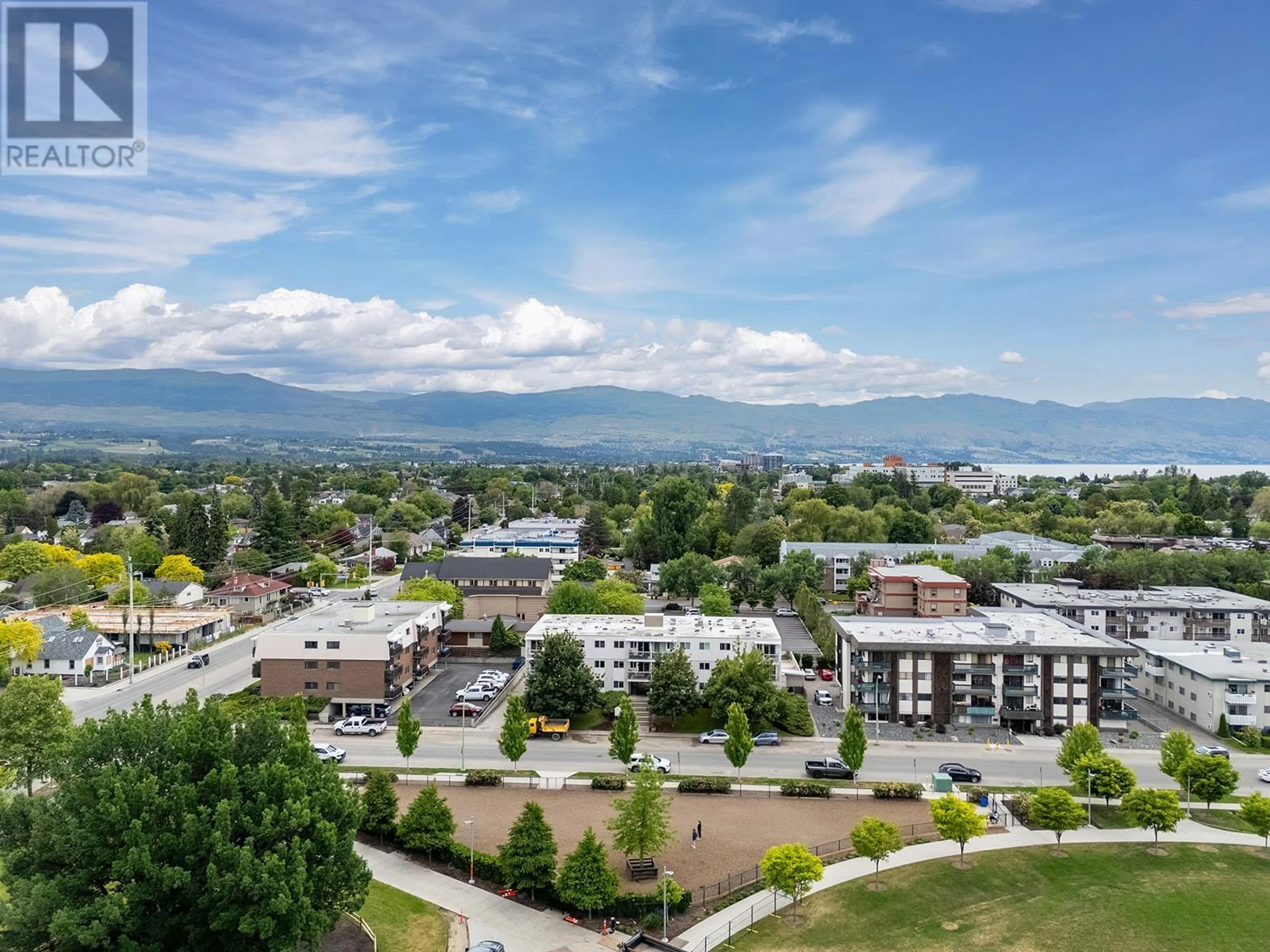 A pic from outside/outdoor area/front of a property/back of a property/a pic from drone, mountain view for 203 - 625 ROWCLIFFE AVENUE, Kelowna British Columbia V1Y5Y8