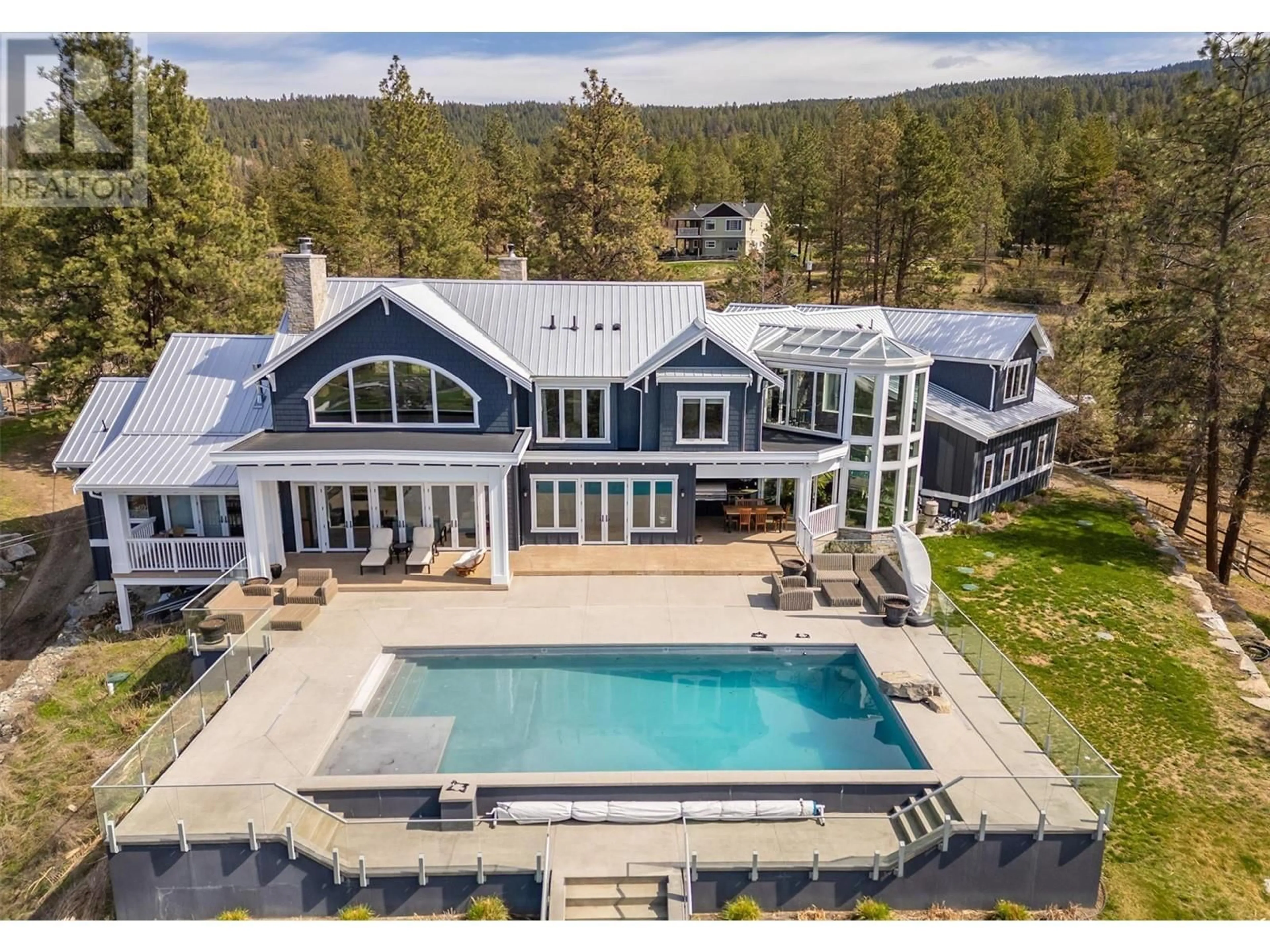 A pic from outside/outdoor area/front of a property/back of a property/a pic from drone, mountain view for 5474 DEADPINE DRIVE, Kelowna British Columbia V1P1A3