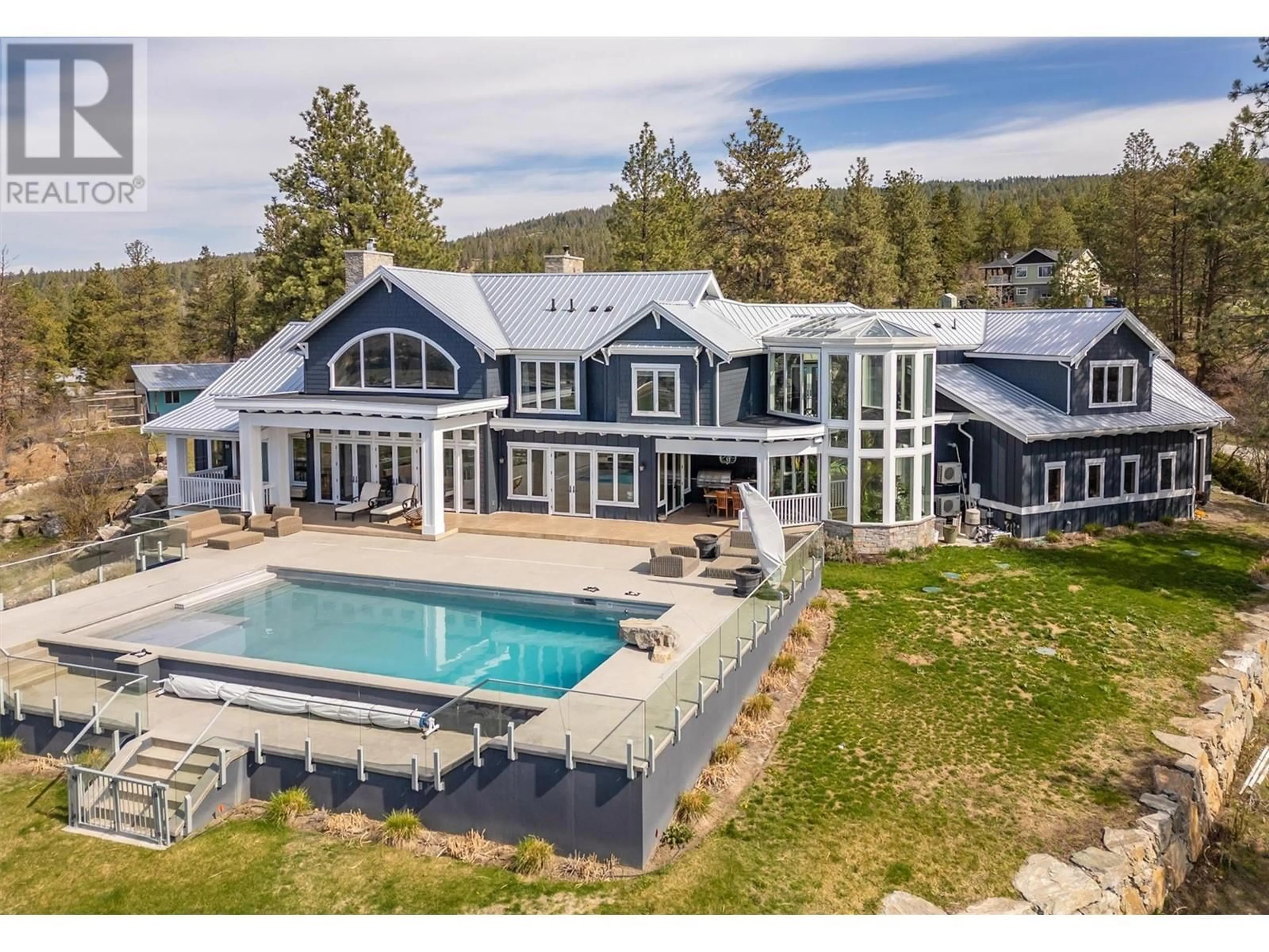 A pic from outside/outdoor area/front of a property/back of a property/a pic from drone, mountain view for 5474 DEADPINE DRIVE, Kelowna British Columbia V1P1A3