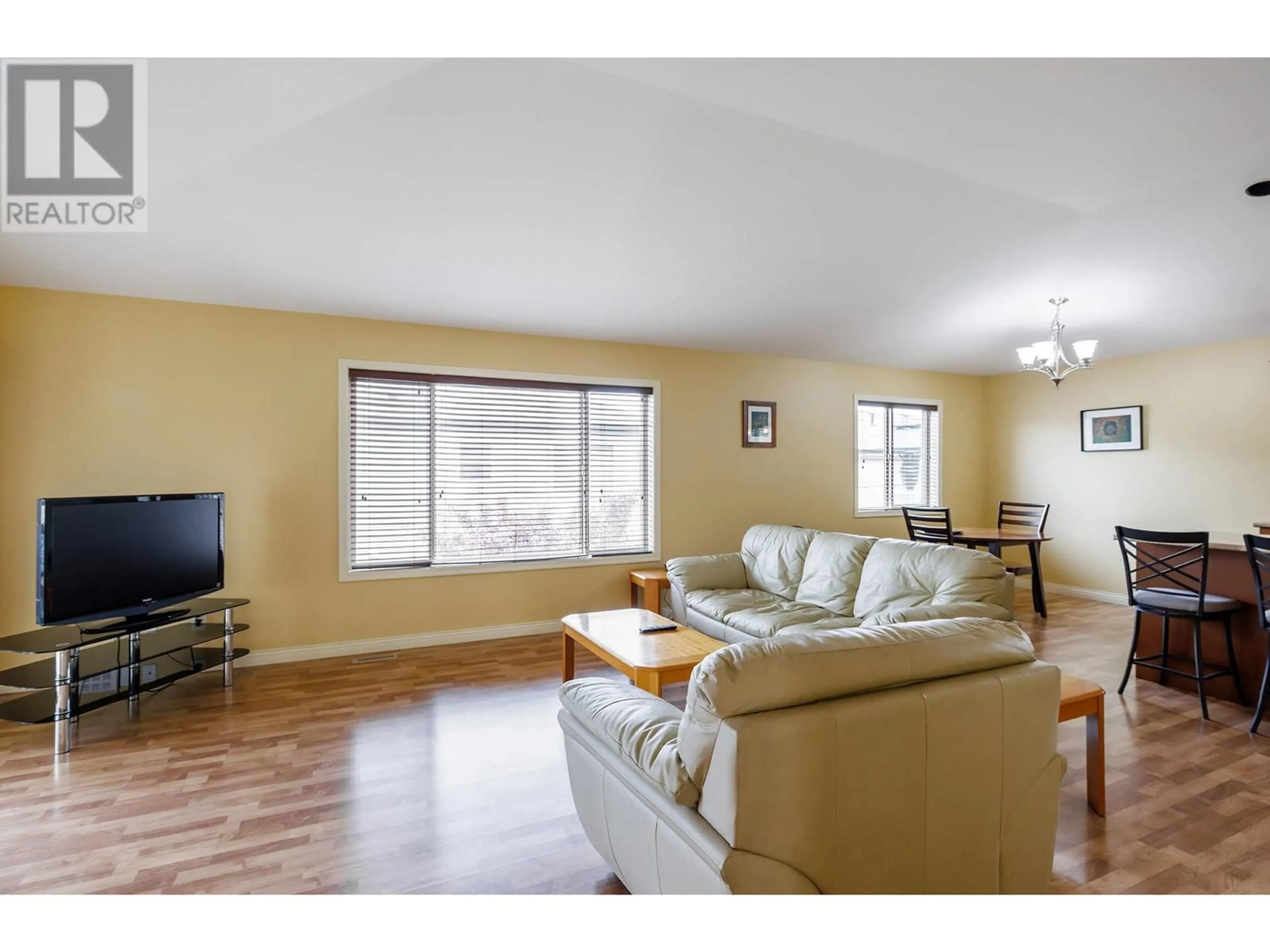 Living room with furniture, wood/laminate floor for 13 - 11392 LODGE ROAD, Lake Country British Columbia V4V1X2