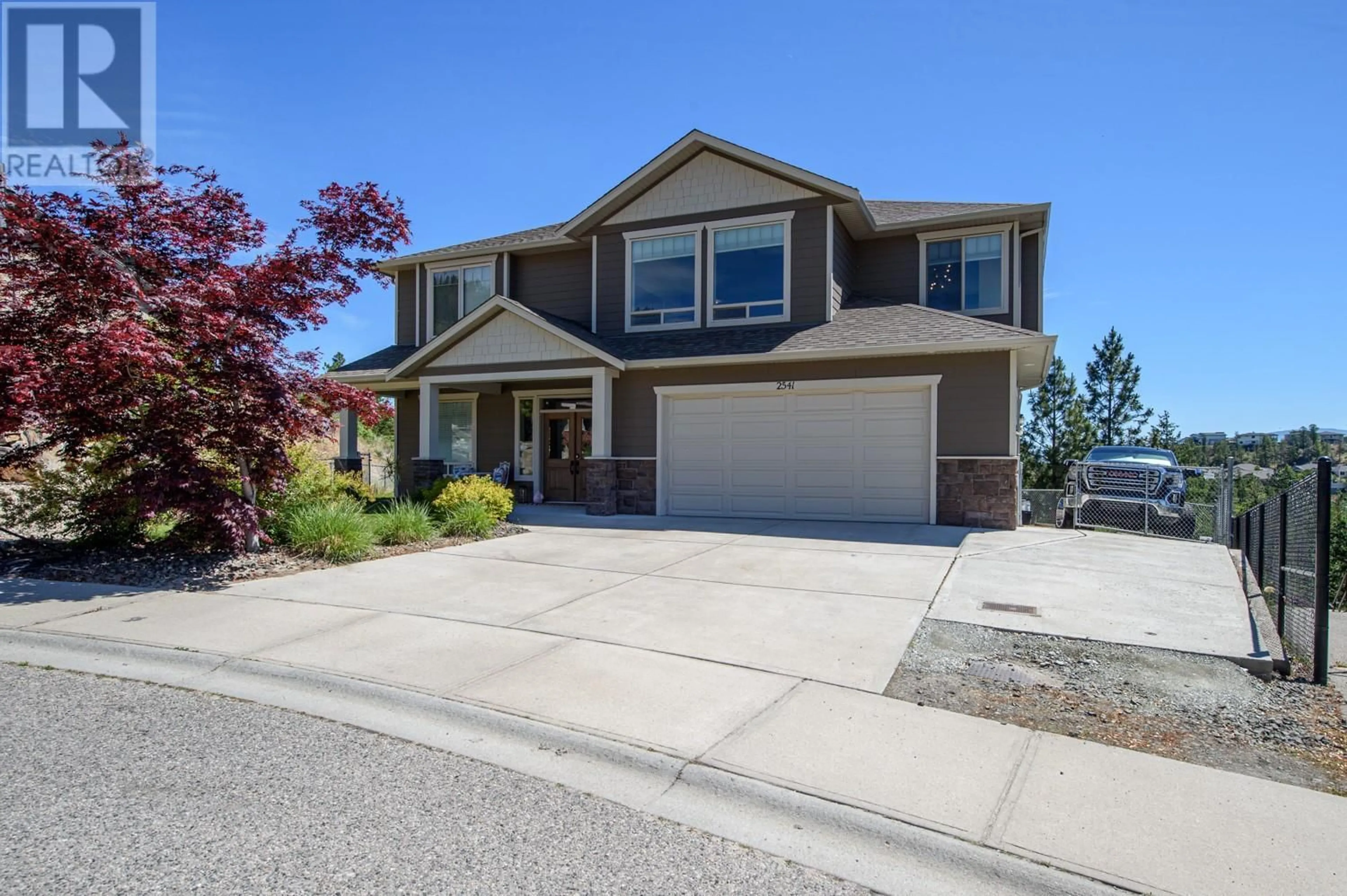 Home with vinyl exterior material, street for 2541 COPPER RIDGE DRIVE, West Kelowna British Columbia V4T2X6