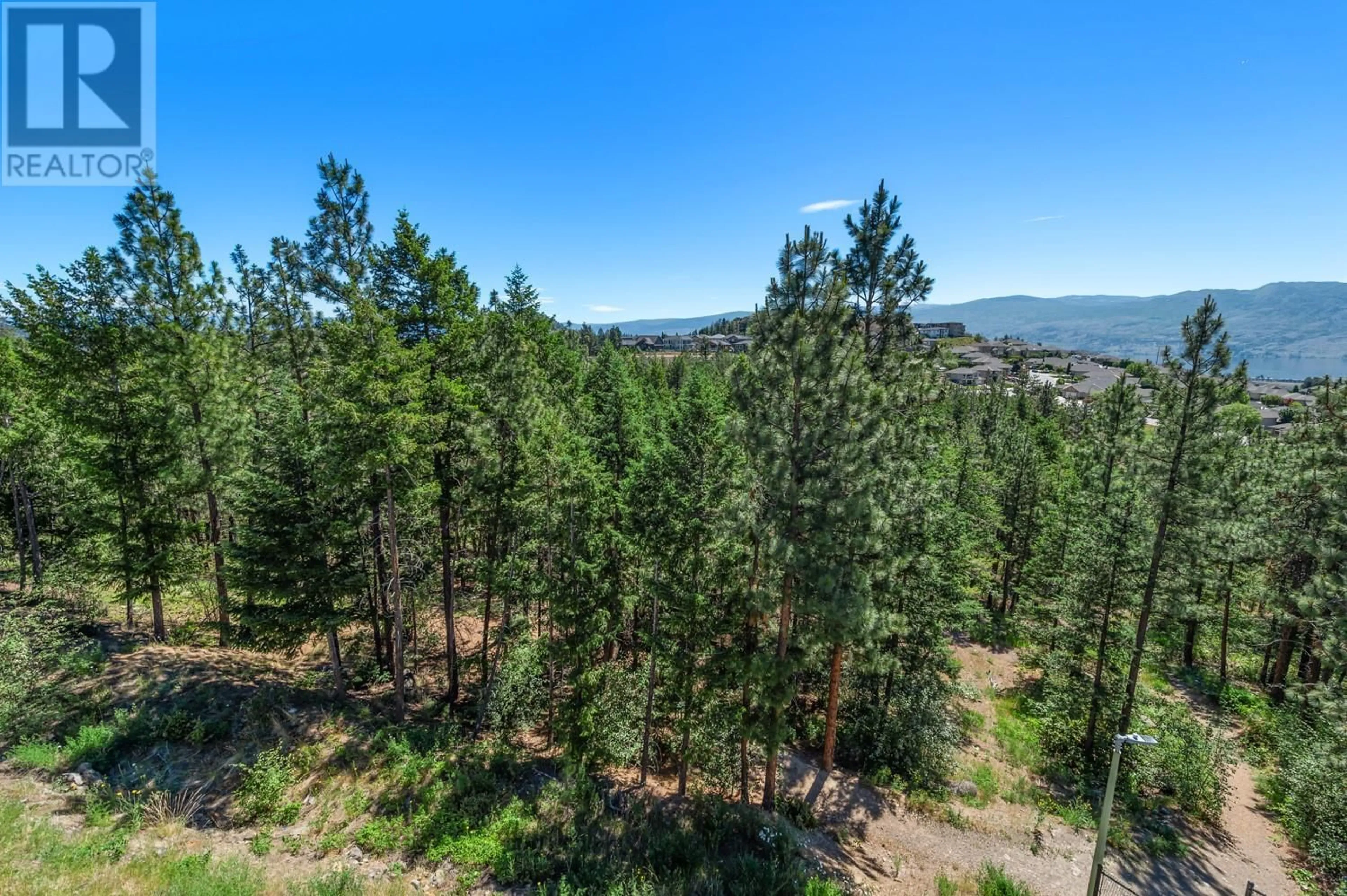 A pic from outside/outdoor area/front of a property/back of a property/a pic from drone, forest/trees view for 2541 COPPER RIDGE DRIVE, West Kelowna British Columbia V4T2X6