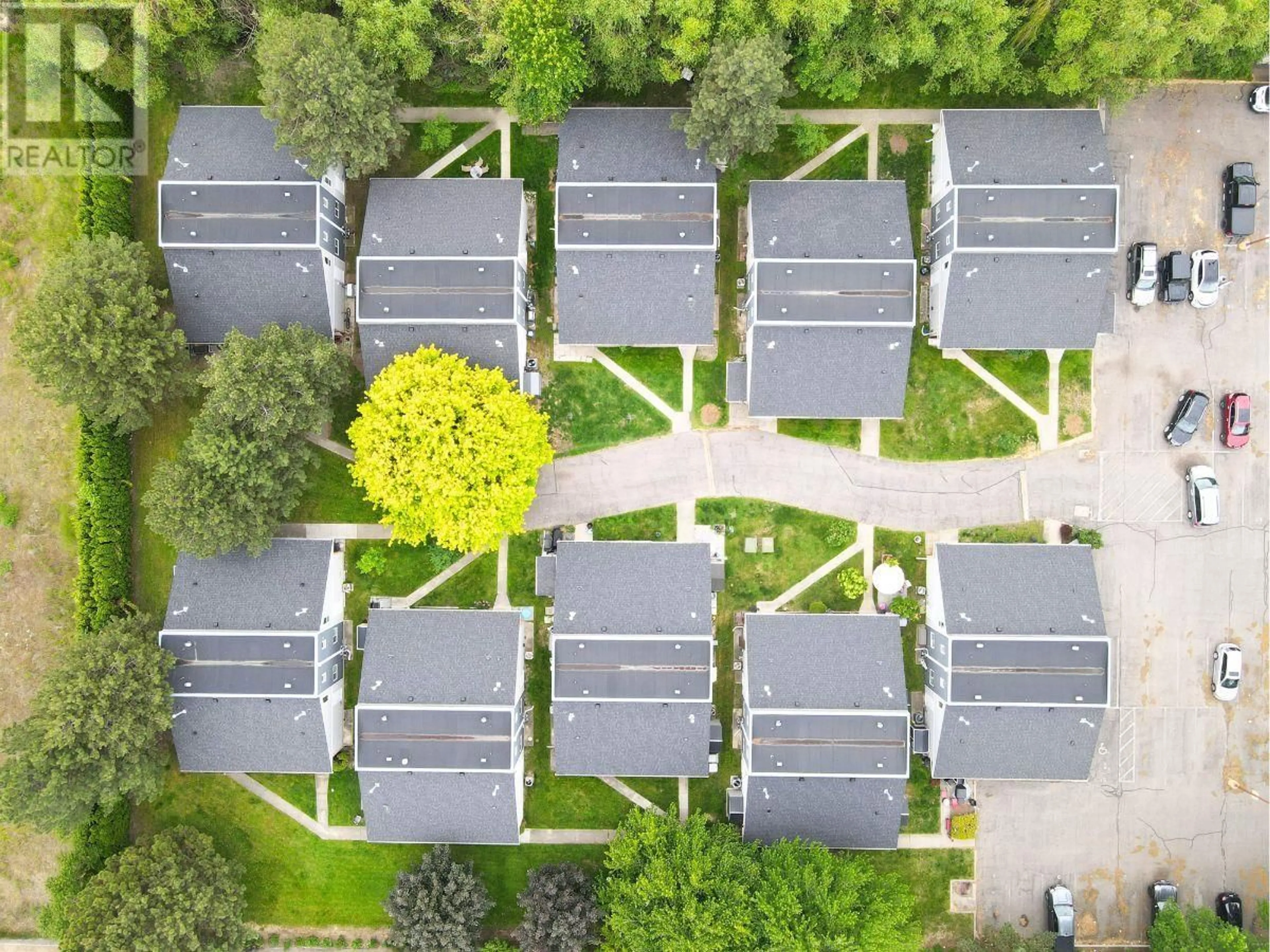 A pic from outside/outdoor area/front of a property/back of a property/a pic from drone, street for 202 - 3155 GORDON DRIVE, Kelowna British Columbia V1W3N5