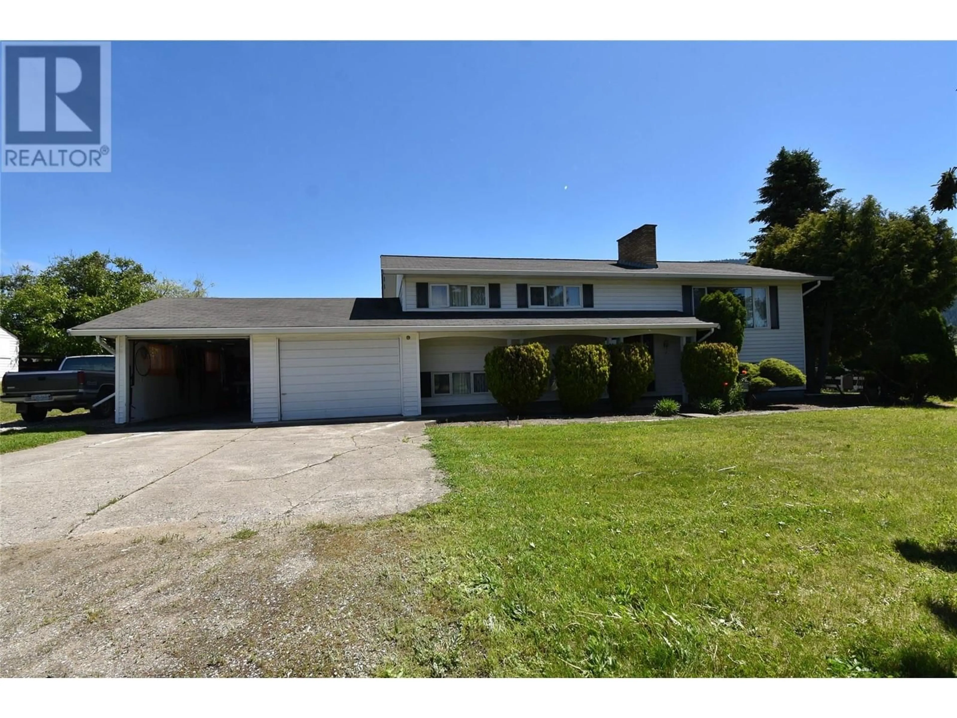 A pic from outside/outdoor area/front of a property/back of a property/a pic from drone, street for 5425 SILVER STAR ROAD, Vernon British Columbia V1B3K4