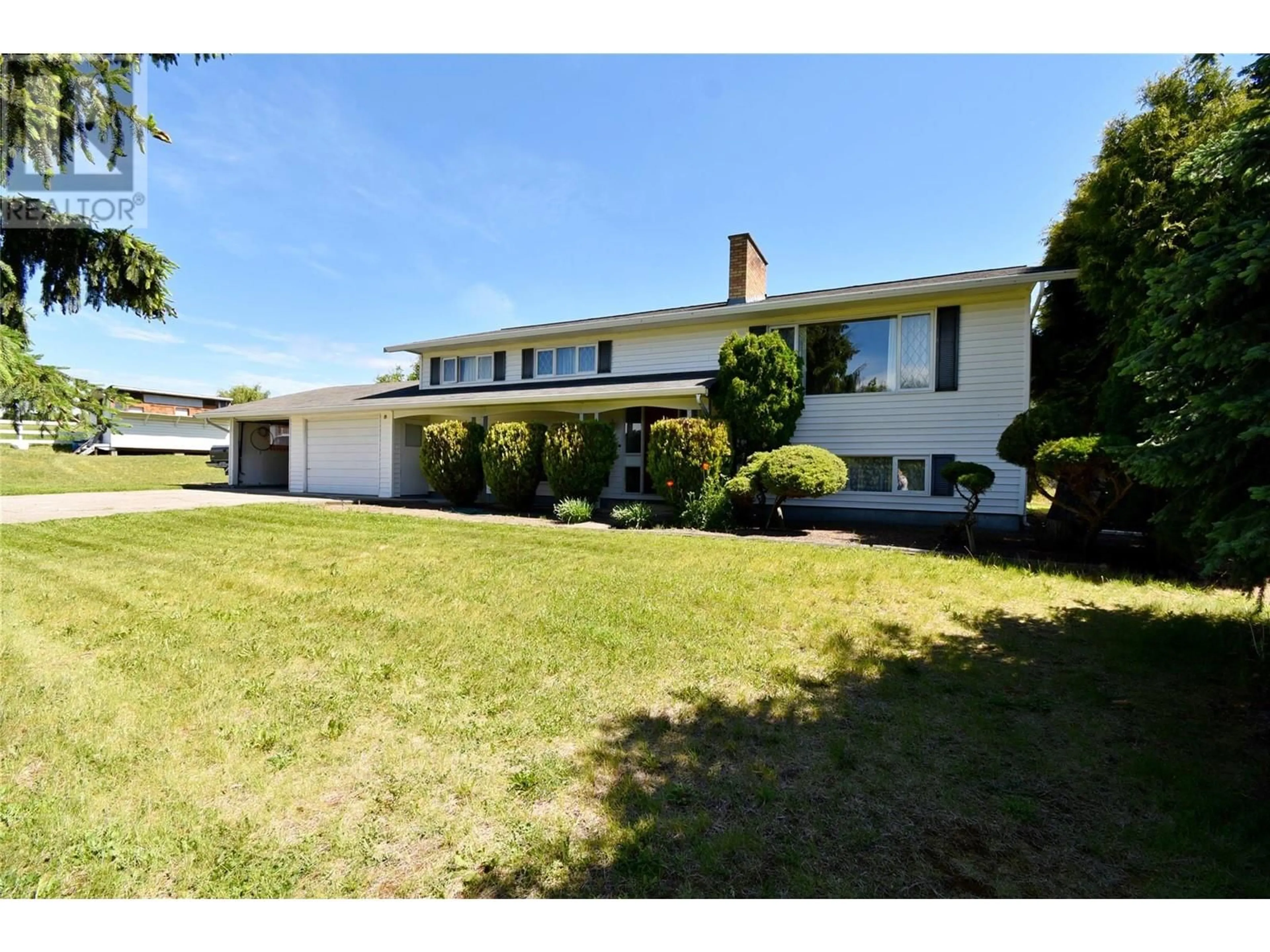 A pic from outside/outdoor area/front of a property/back of a property/a pic from drone, street for 5425 SILVER STAR ROAD, Vernon British Columbia V1B3K4