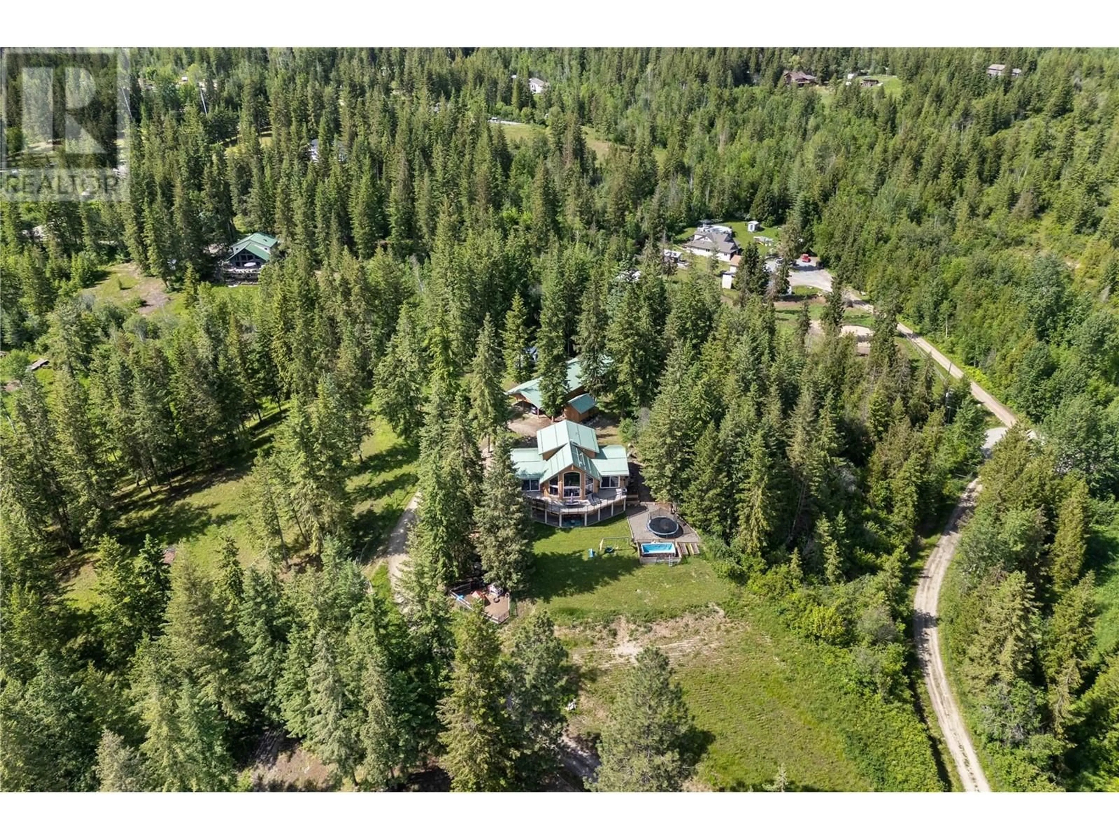 A pic from outside/outdoor area/front of a property/back of a property/a pic from drone, forest/trees view for 65 FURLONG ROAD, Enderby British Columbia V0E1V3