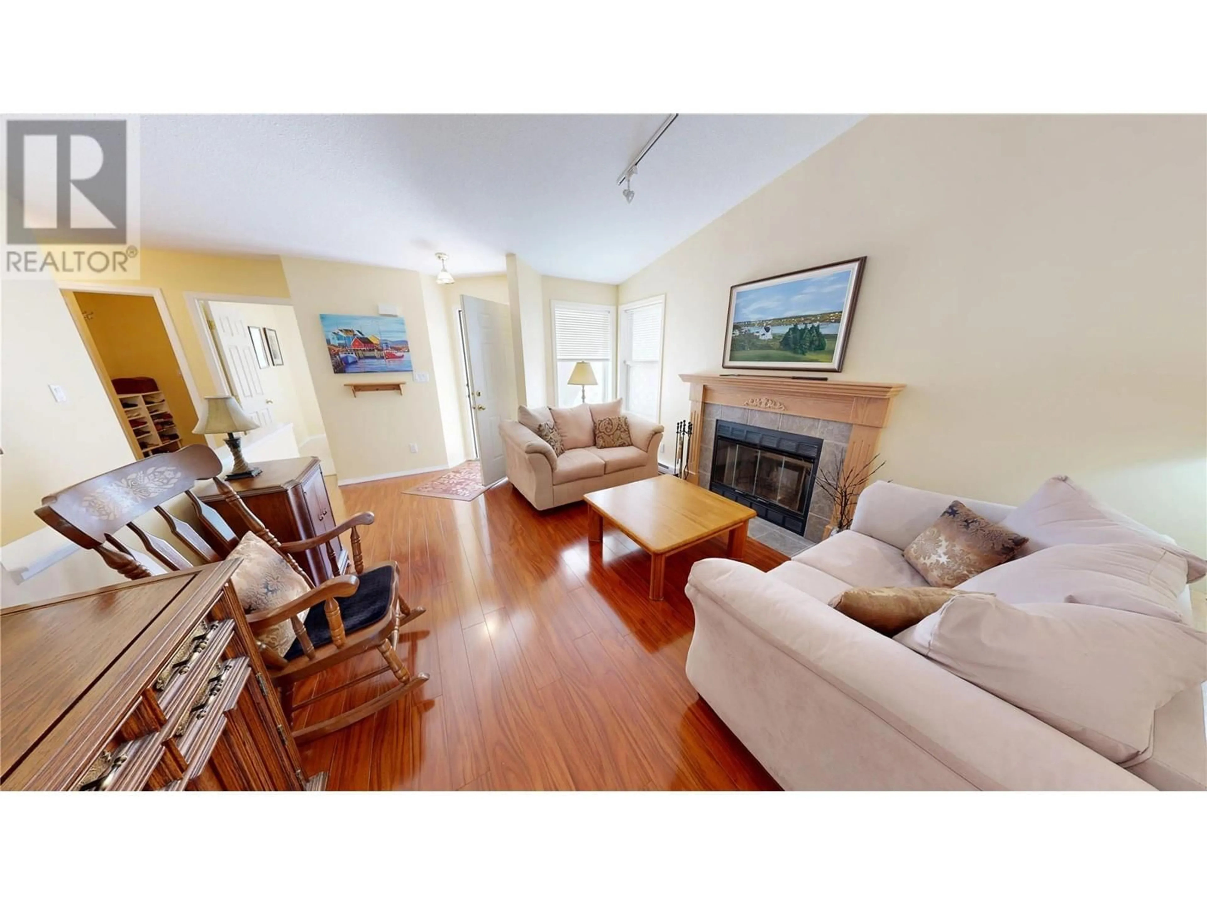 Living room with furniture, wood/laminate floor for 21 - 7515 COLUMBIA AVENUE, Radium Hot Springs British Columbia V0A1M0