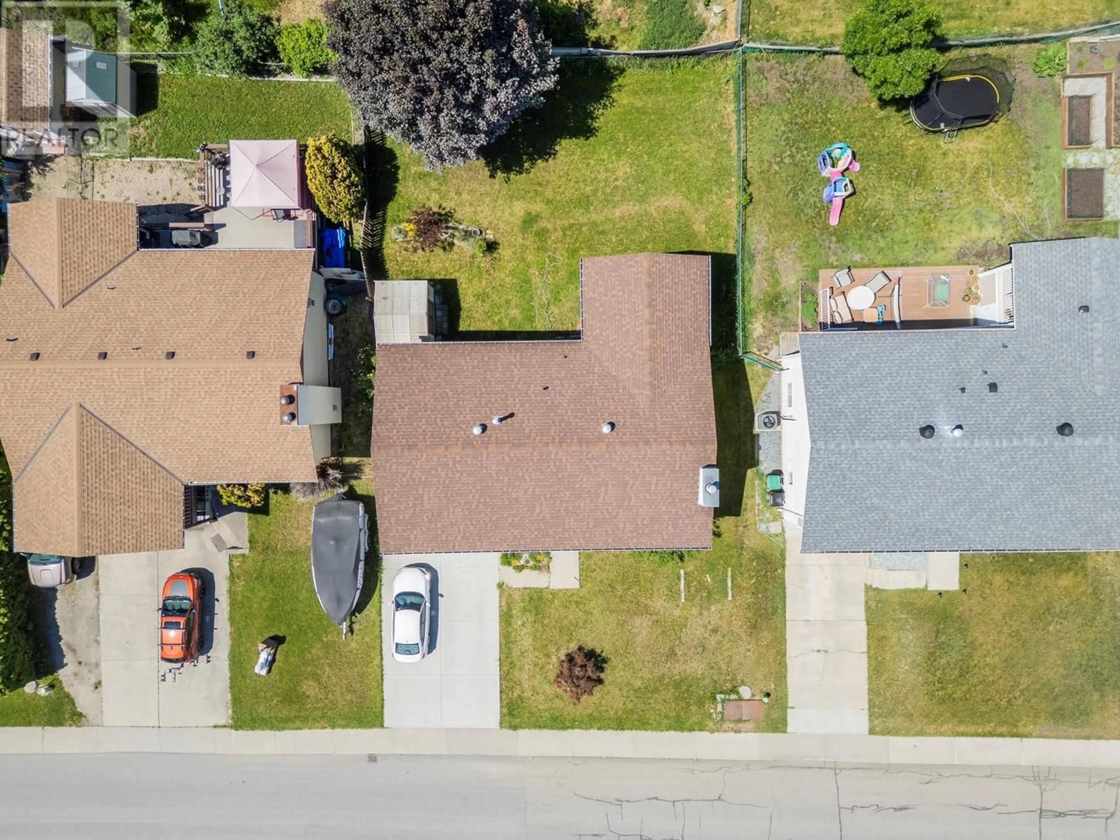 A pic from outside/outdoor area/front of a property/back of a property/a pic from drone, street for 1904 18 STREET, Vernon British Columbia V1T8G2