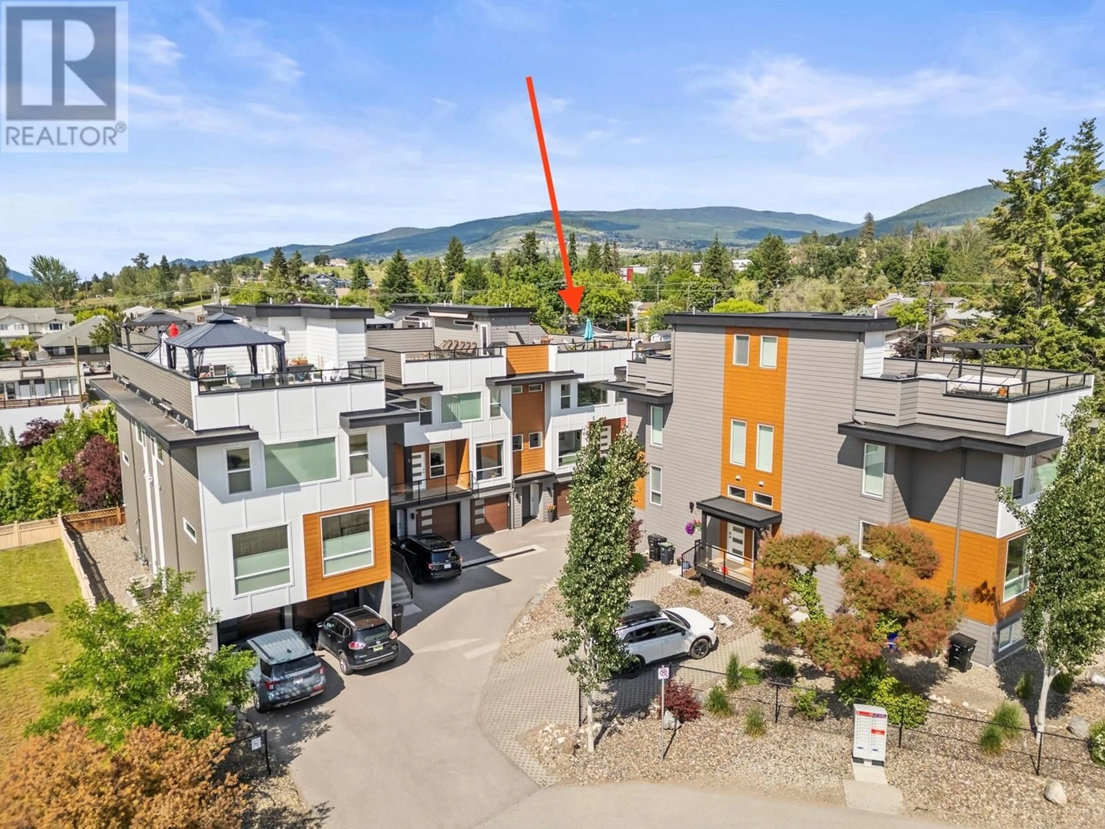 A pic from outside/outdoor area/front of a property/back of a property/a pic from drone, mountain view for 4 - 1805 45 AVENUE, Vernon British Columbia V1T7T7