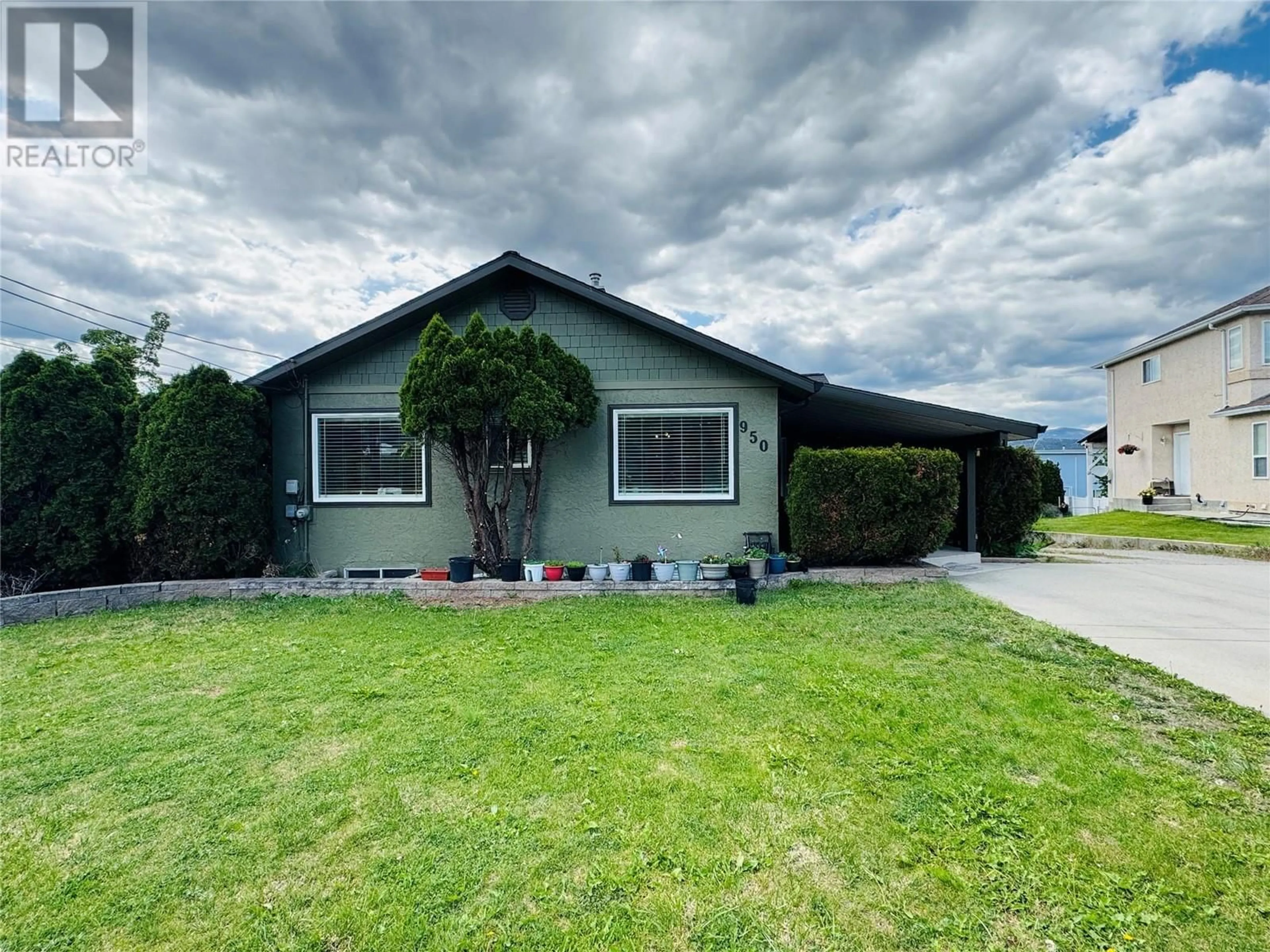 Home with vinyl exterior material, street for 950 MAYGARD ROAD, Kelowna British Columbia V1X5X1
