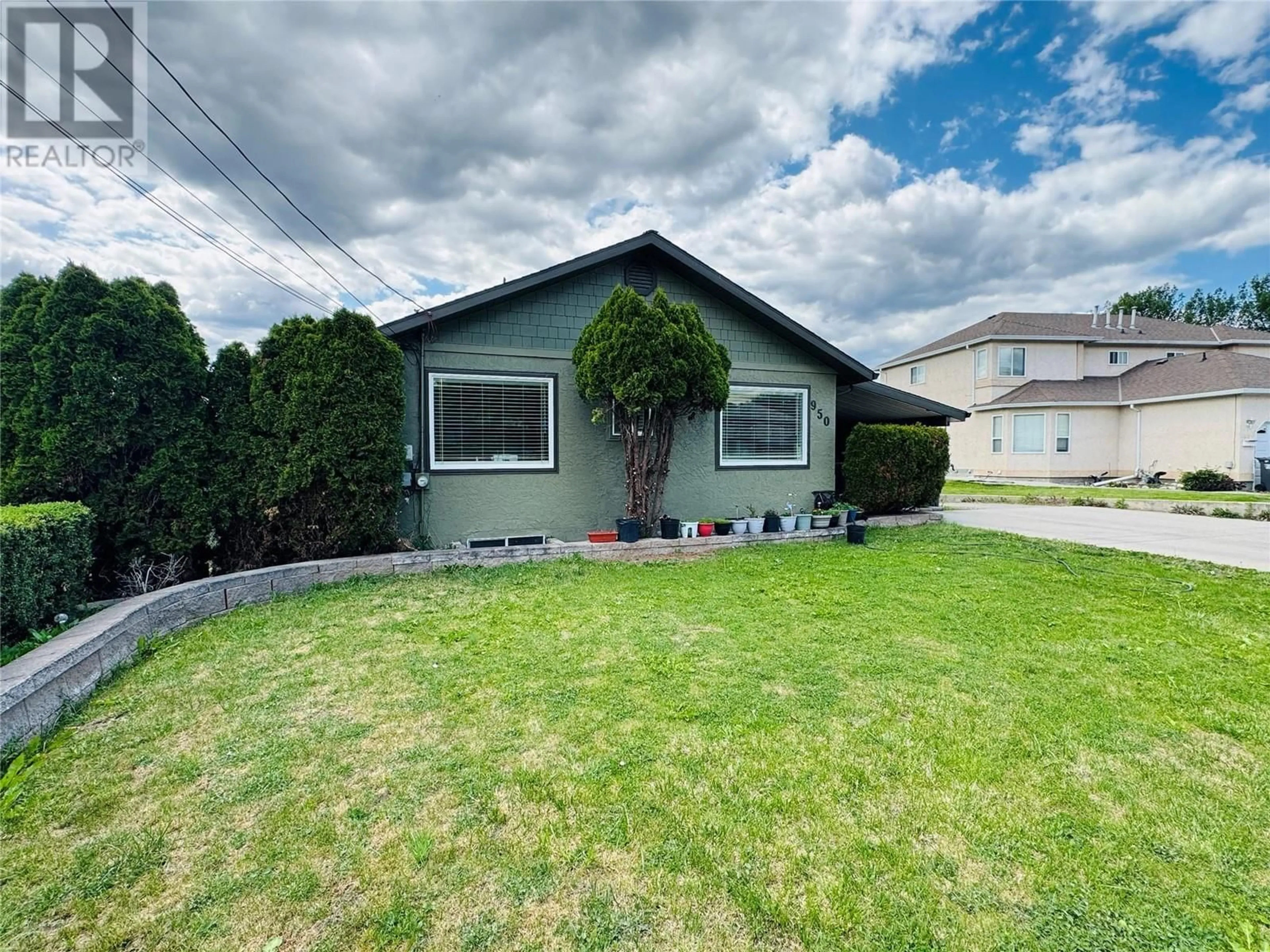 Home with vinyl exterior material, street for 950 MAYGARD ROAD, Kelowna British Columbia V1X5X1