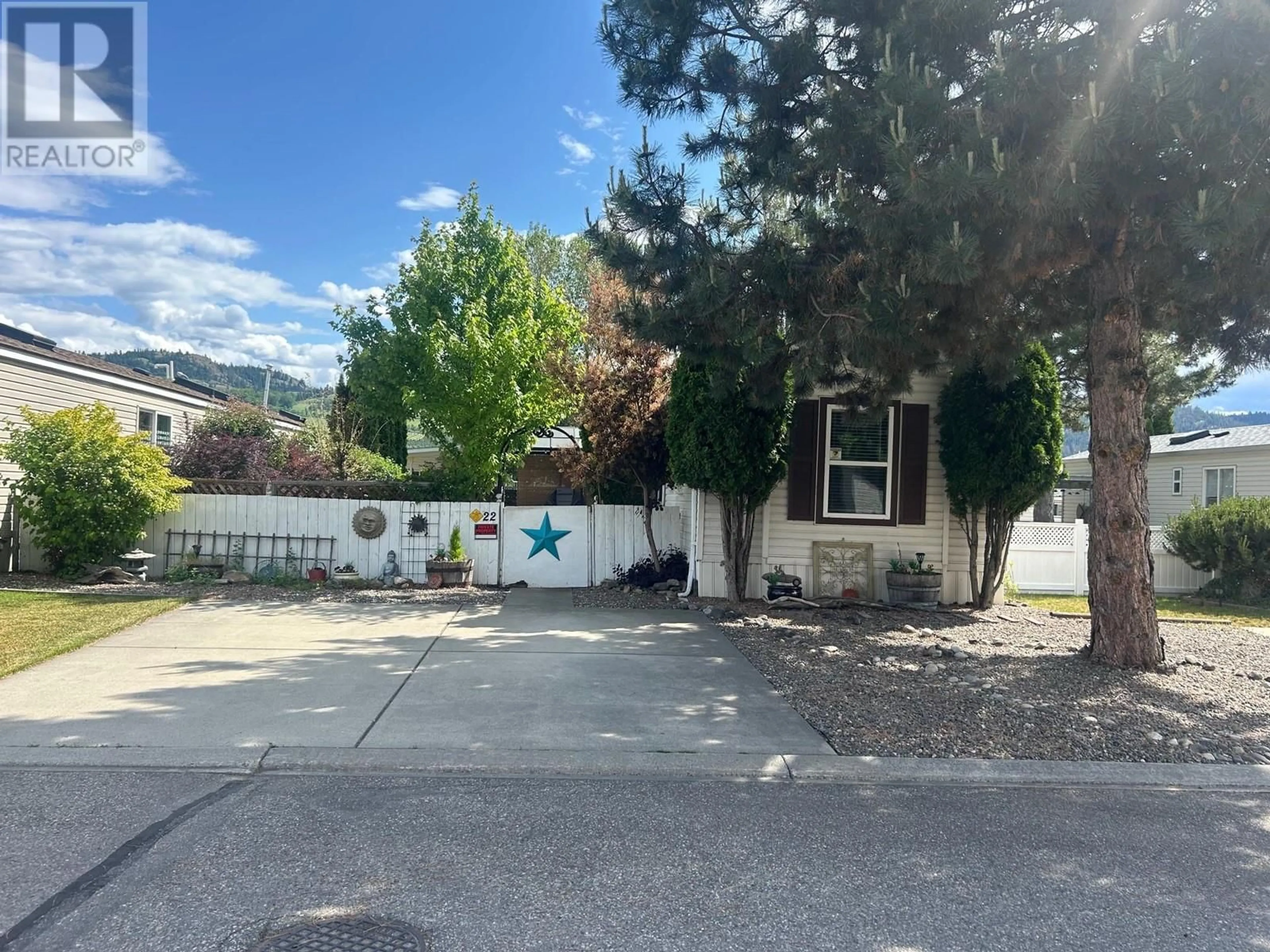 A pic from outside/outdoor area/front of a property/back of a property/a pic from drone, street for 22 - 6688 TRONSON ROAD, Vernon British Columbia V1H1R9