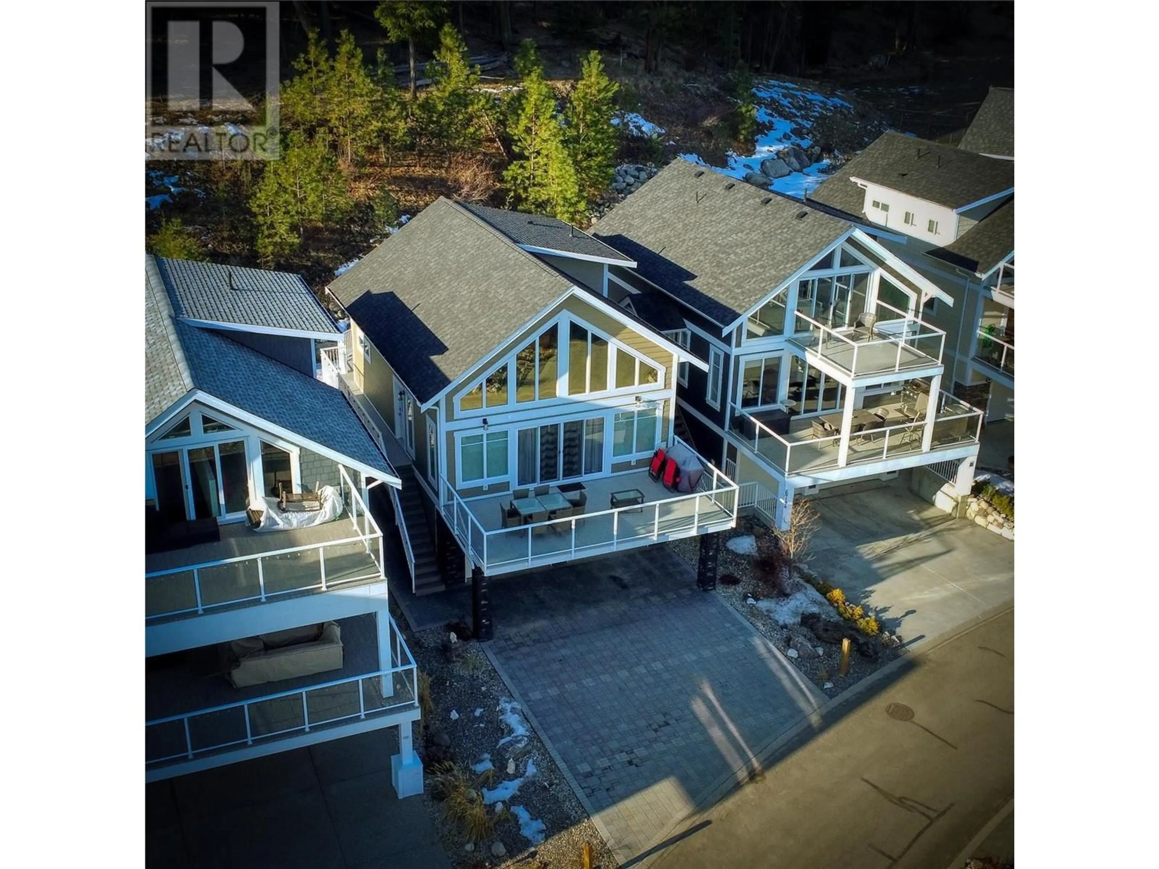 A pic from outside/outdoor area/front of a property/back of a property/a pic from drone, street for 302 - 6742 MARBELLA LOOP, Kelowna British Columbia V1Z3R8