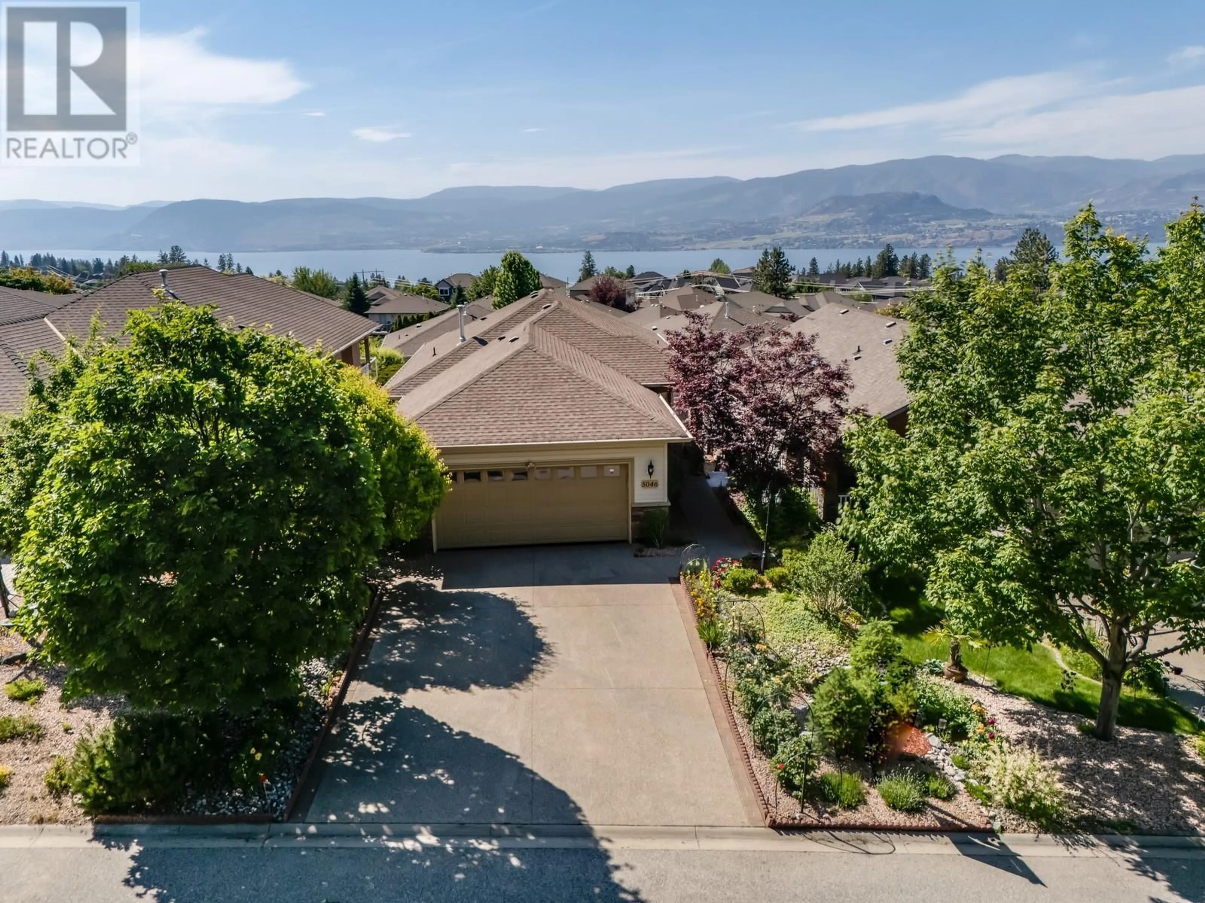 A pic from outside/outdoor area/front of a property/back of a property/a pic from drone, water/lake/river/ocean view for 5046 SOUTH RIDGE DRIVE, Kelowna British Columbia V1W4W7