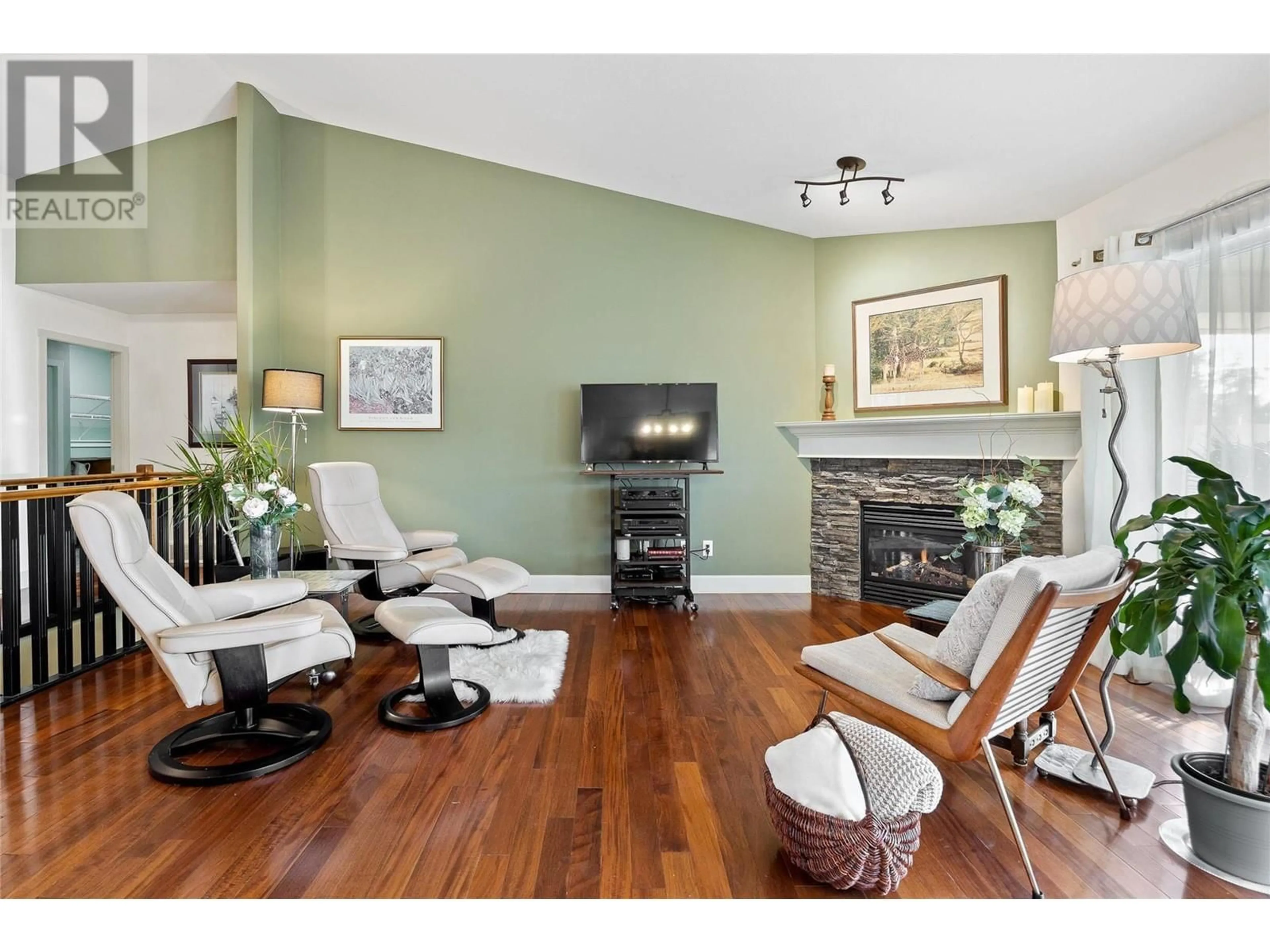 Living room with furniture, wood/laminate floor for 3602 SHADOW CREEK DRIVE, Kelowna British Columbia V1X8A7