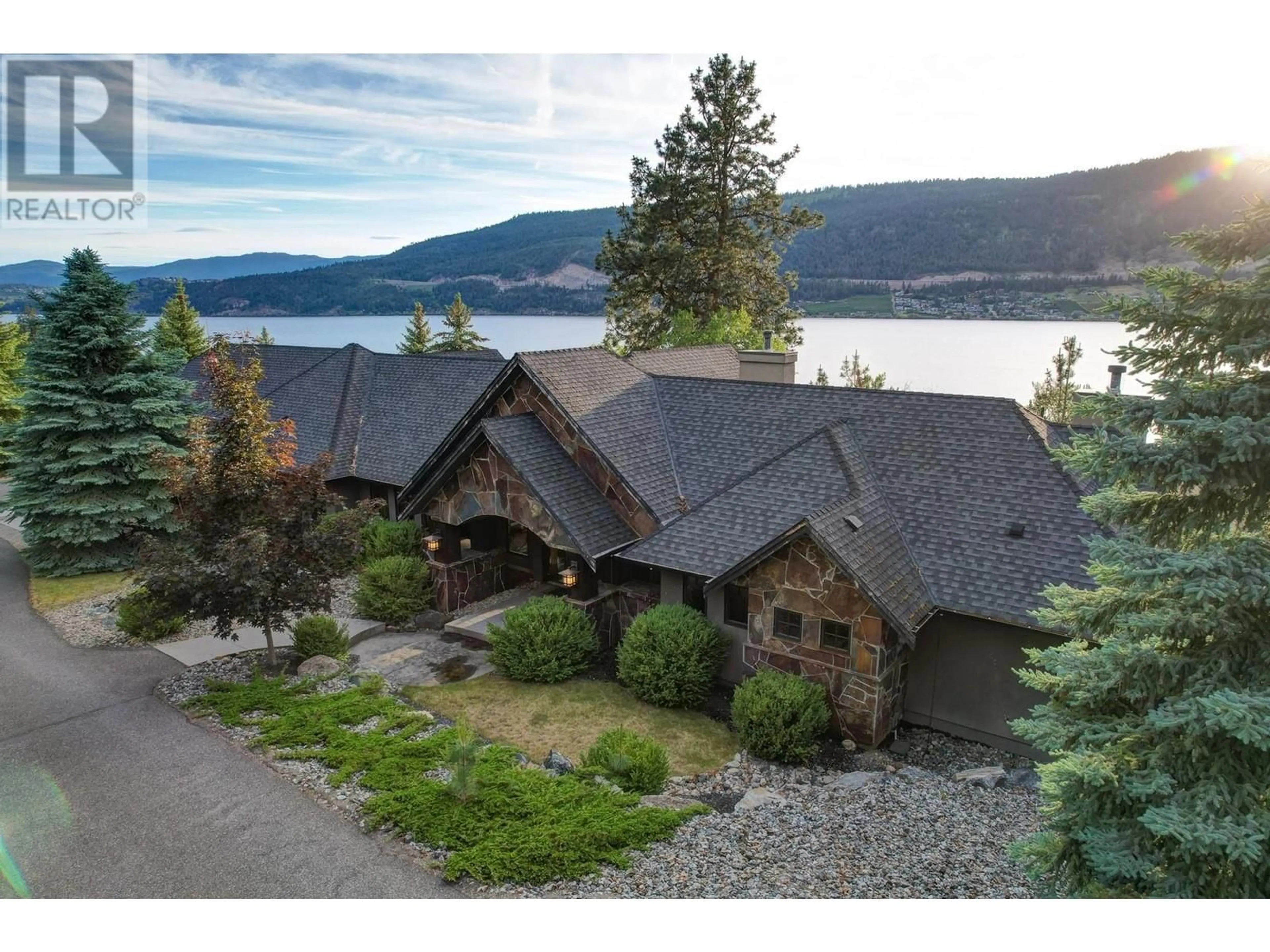 A pic from outside/outdoor area/front of a property/back of a property/a pic from drone, water/lake/river/ocean view for 15026 OYAMA ROAD, Lake Country British Columbia V4V2C6