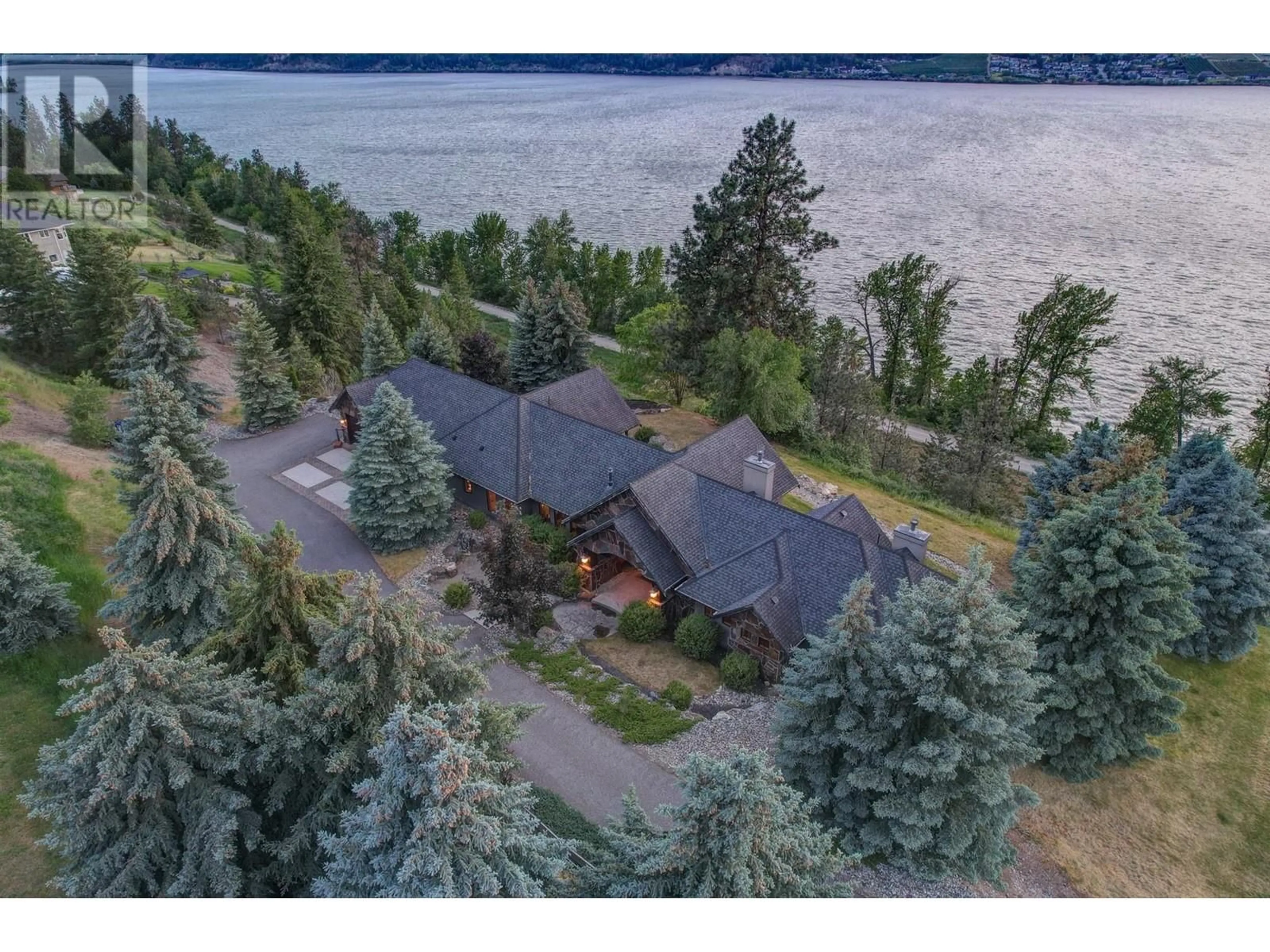 A pic from outside/outdoor area/front of a property/back of a property/a pic from drone, water/lake/river/ocean view for 15026 OYAMA ROAD, Lake Country British Columbia V4V2C6