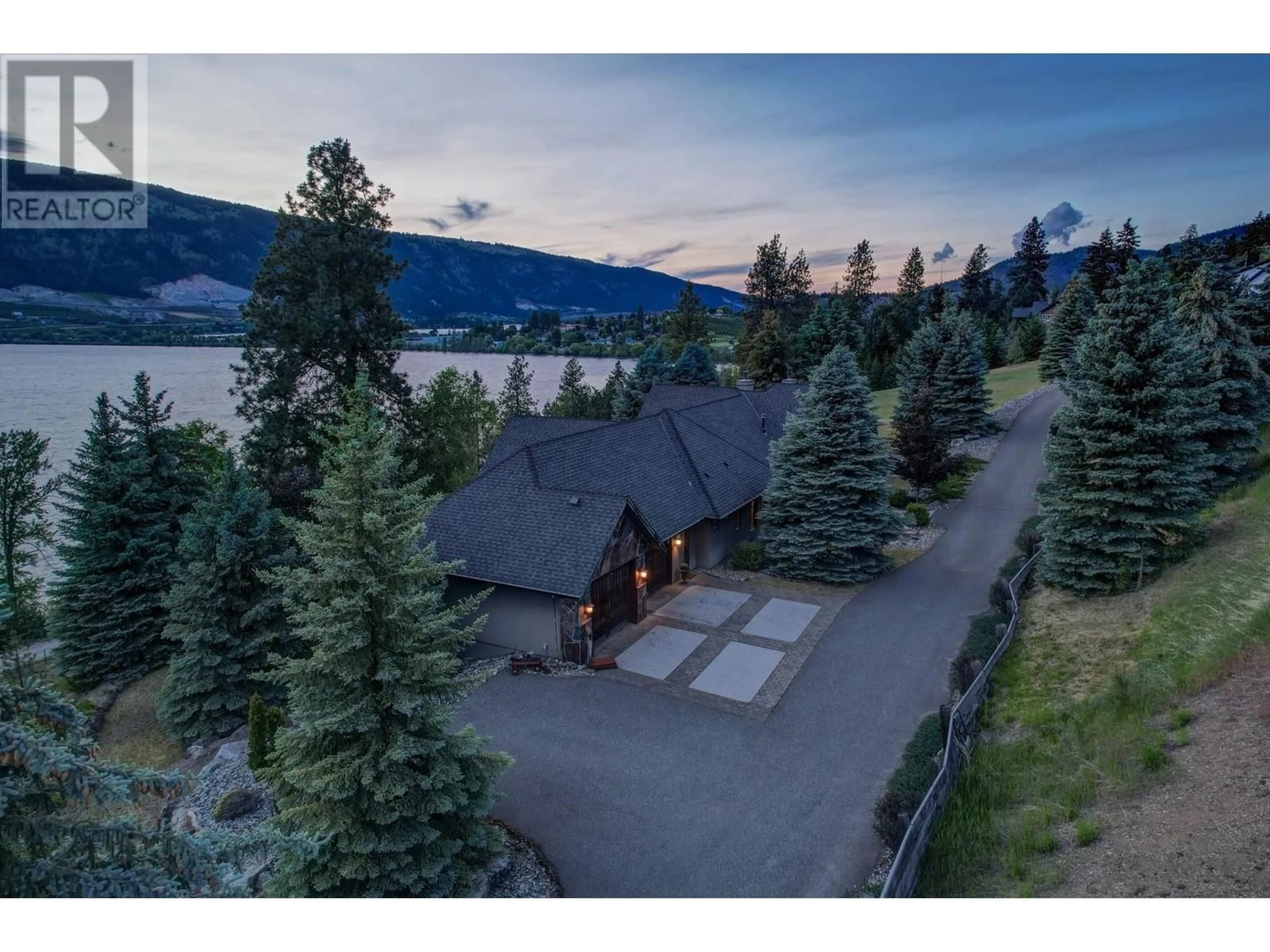 A pic from outside/outdoor area/front of a property/back of a property/a pic from drone, water/lake/river/ocean view for 15026 OYAMA ROAD, Lake Country British Columbia V4V2C6