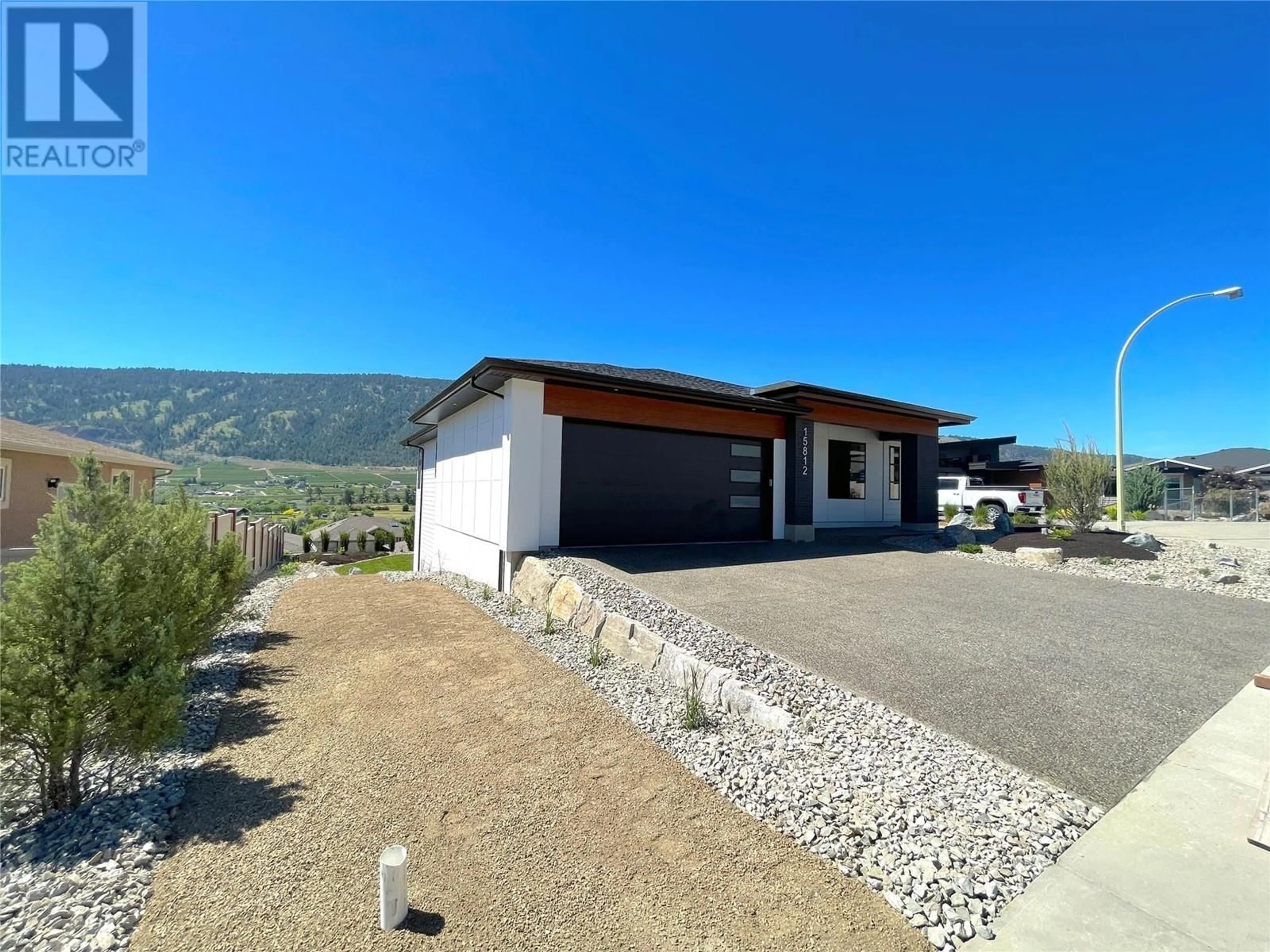 A pic from outside/outdoor area/front of a property/back of a property/a pic from drone, mountain view for 15812 MCDONAGH ROAD, Lake Country British Columbia V4V2E7