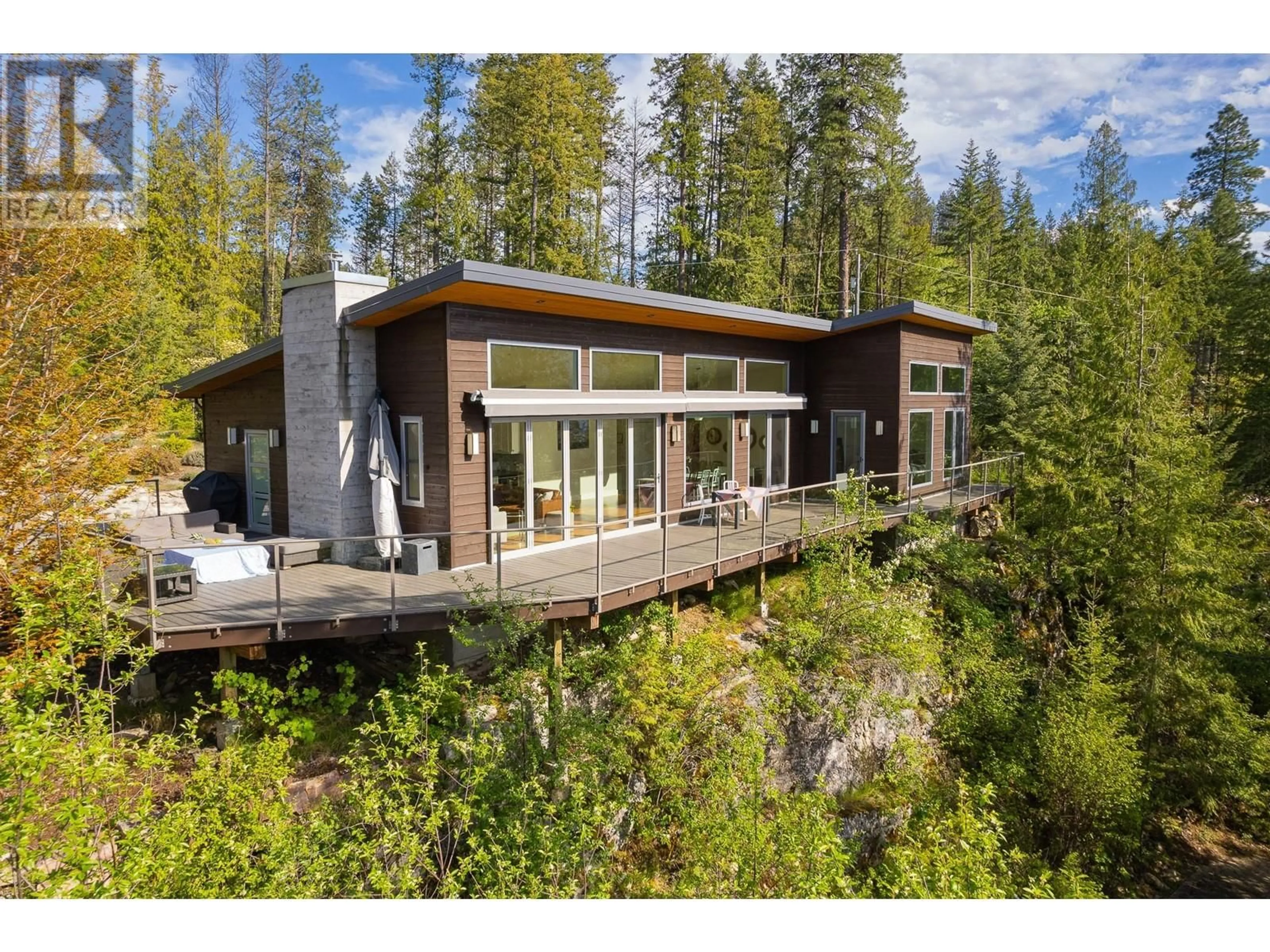 Home with vinyl exterior material, forest/trees view for 17246 PILOT BAY ROAD, Crawford Bay British Columbia V0B1X0