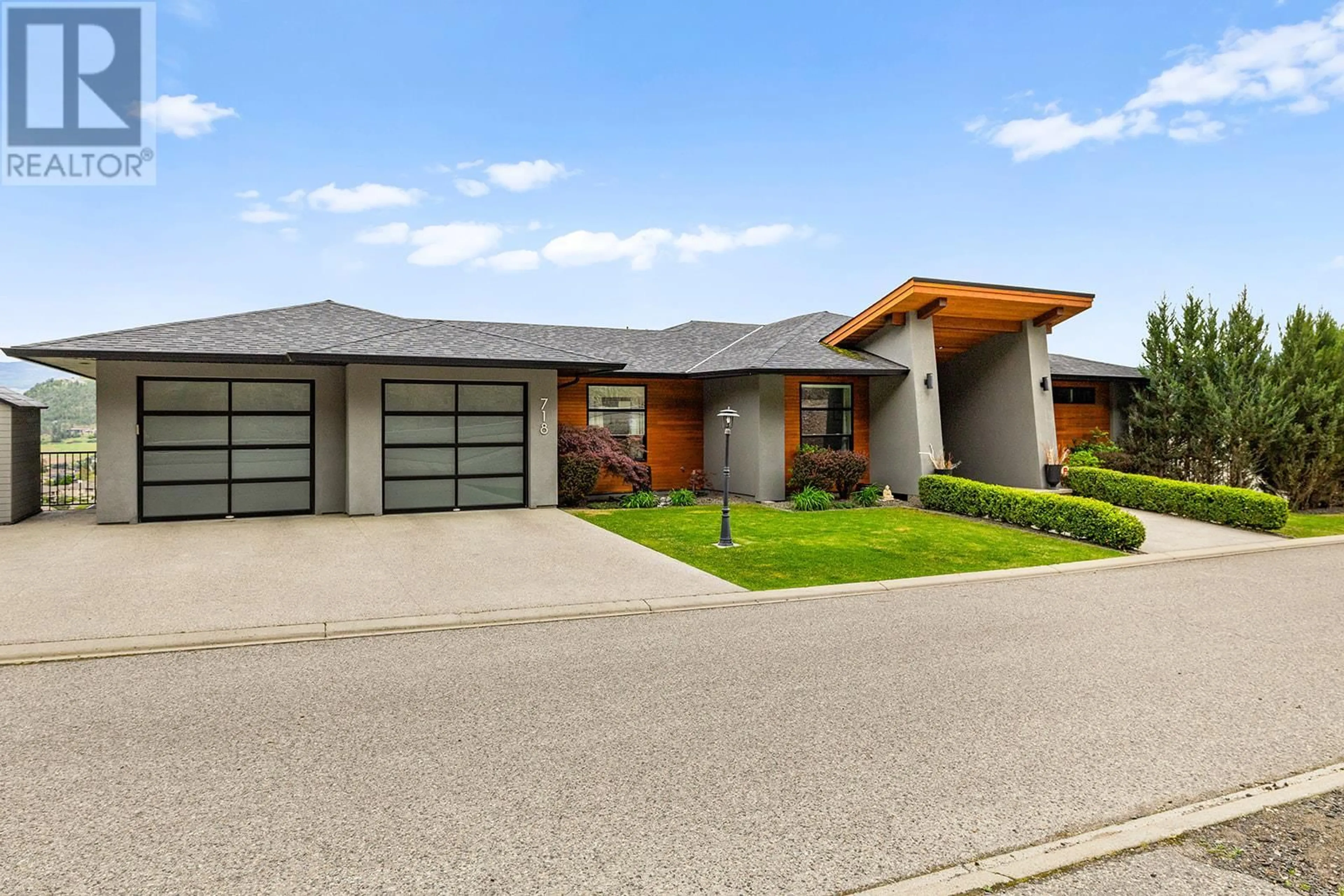 Home with brick exterior material, street for 718 HIGHPOINTE DRIVE, Kelowna British Columbia V1V2Y1