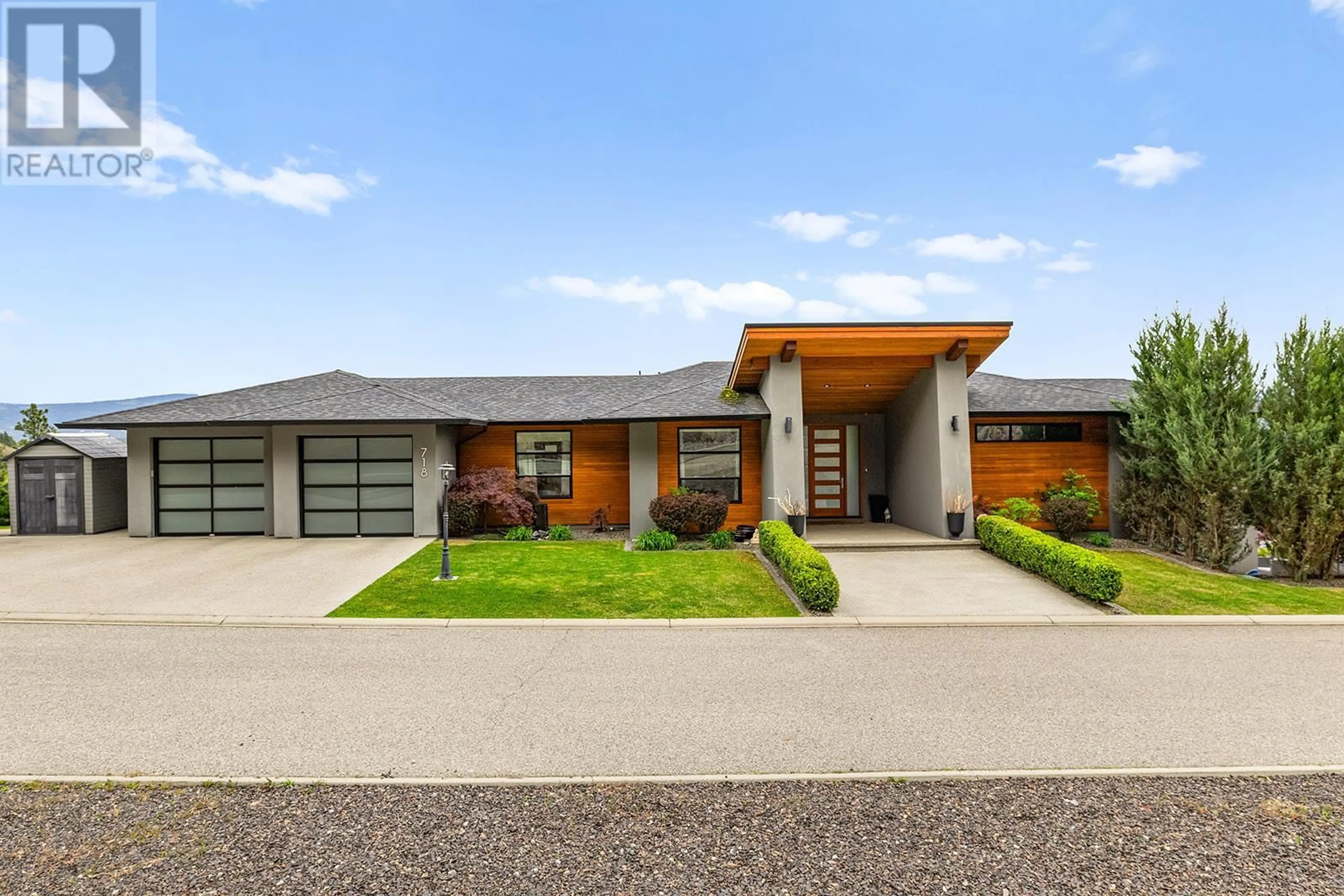 Home with brick exterior material, street for 718 HIGHPOINTE DRIVE, Kelowna British Columbia V1V2Y1