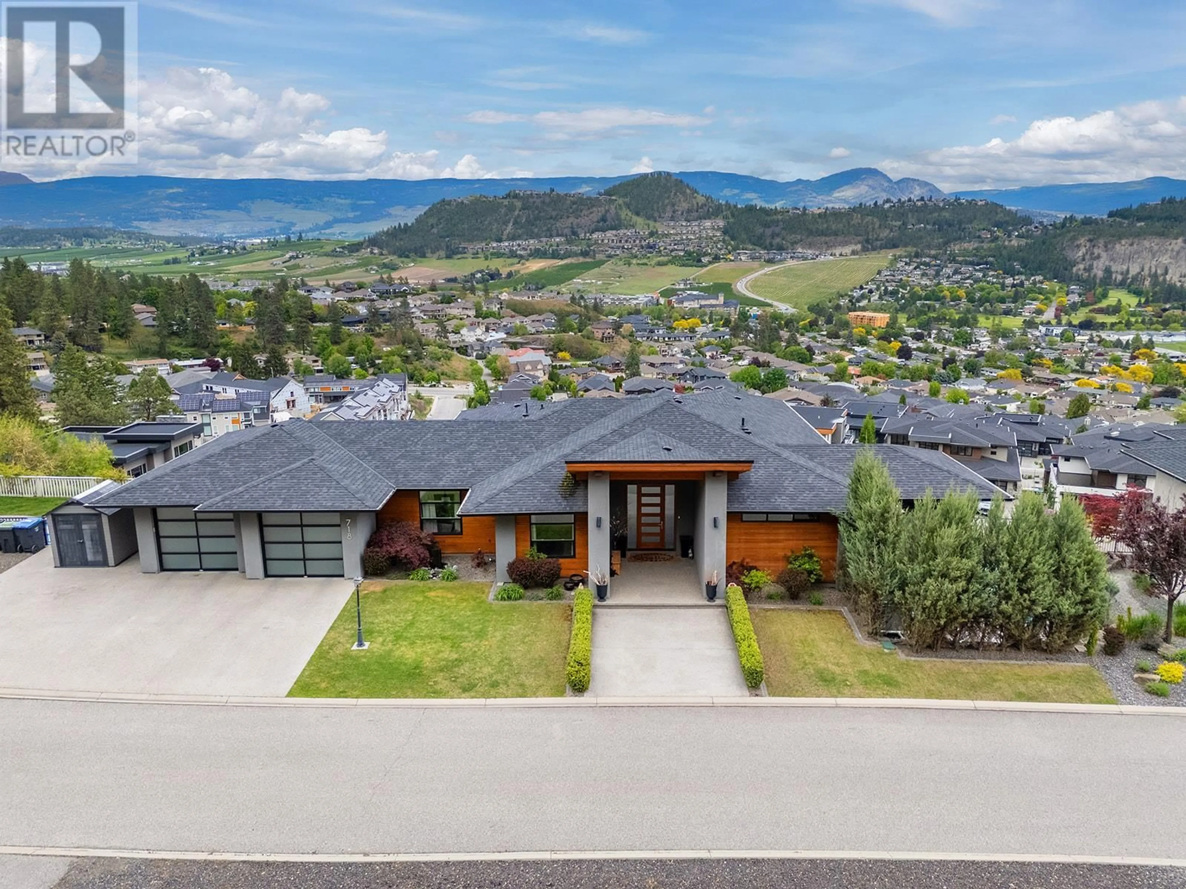A pic from outside/outdoor area/front of a property/back of a property/a pic from drone, mountain view for 718 HIGHPOINTE DRIVE, Kelowna British Columbia V1V2Y1