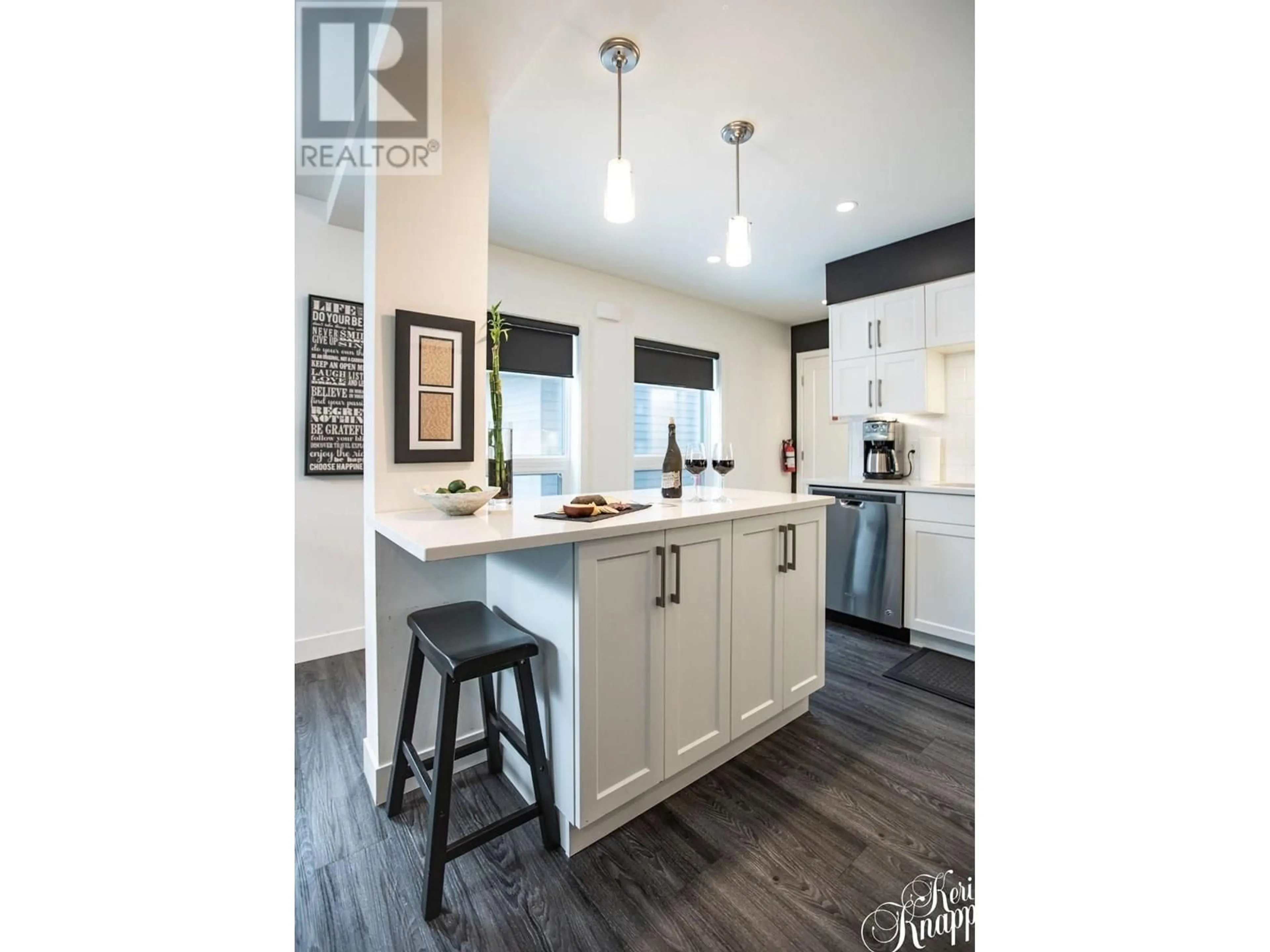 Open concept kitchen, wood/laminate floor for 3100 - 1901 NELS NELSON CRESCENT, Revelstoke British Columbia V0E2S3