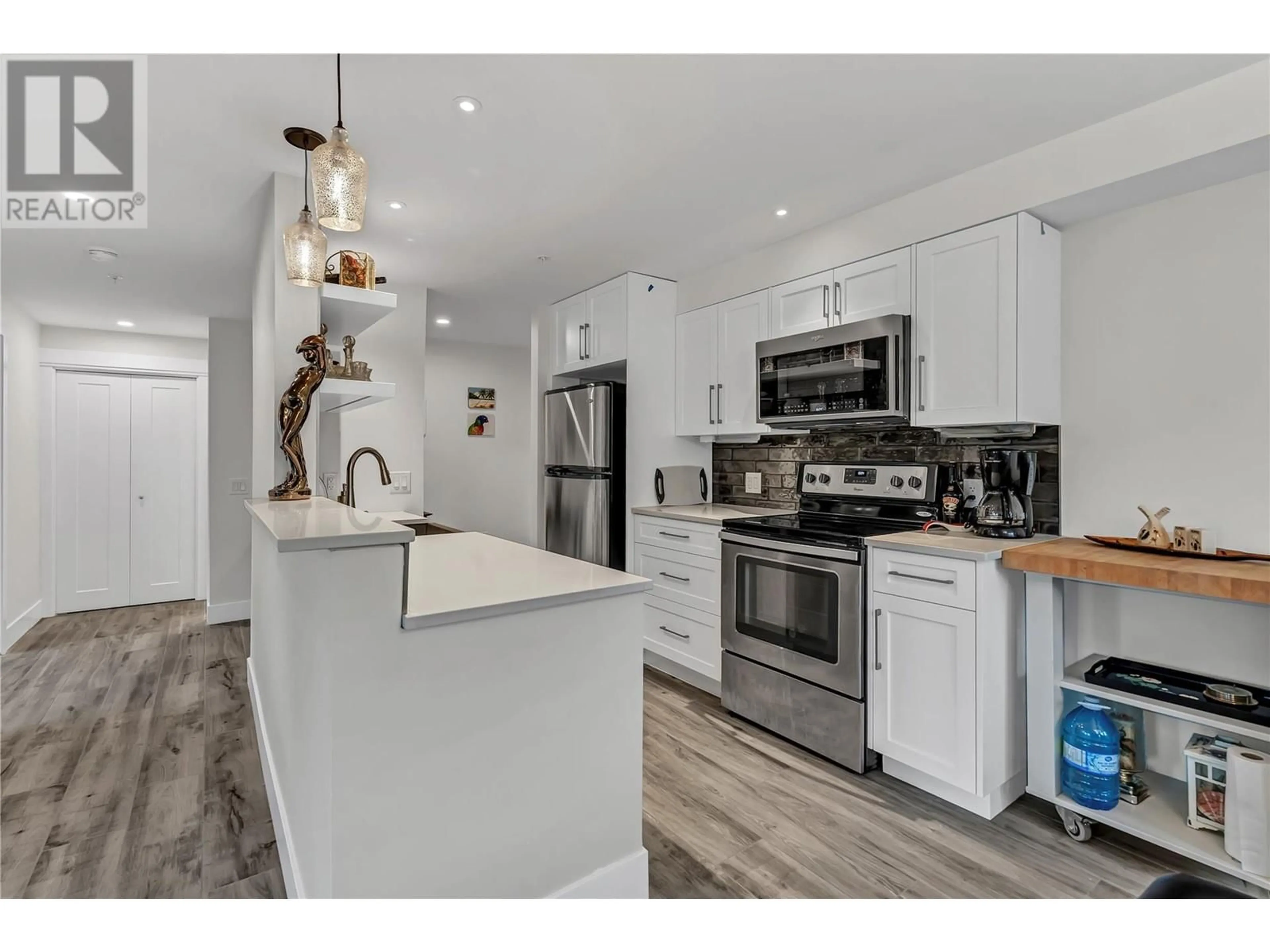 Open concept kitchen, unknown for 105 - 217 ELM AVENUE, Penticton British Columbia V2A3W1