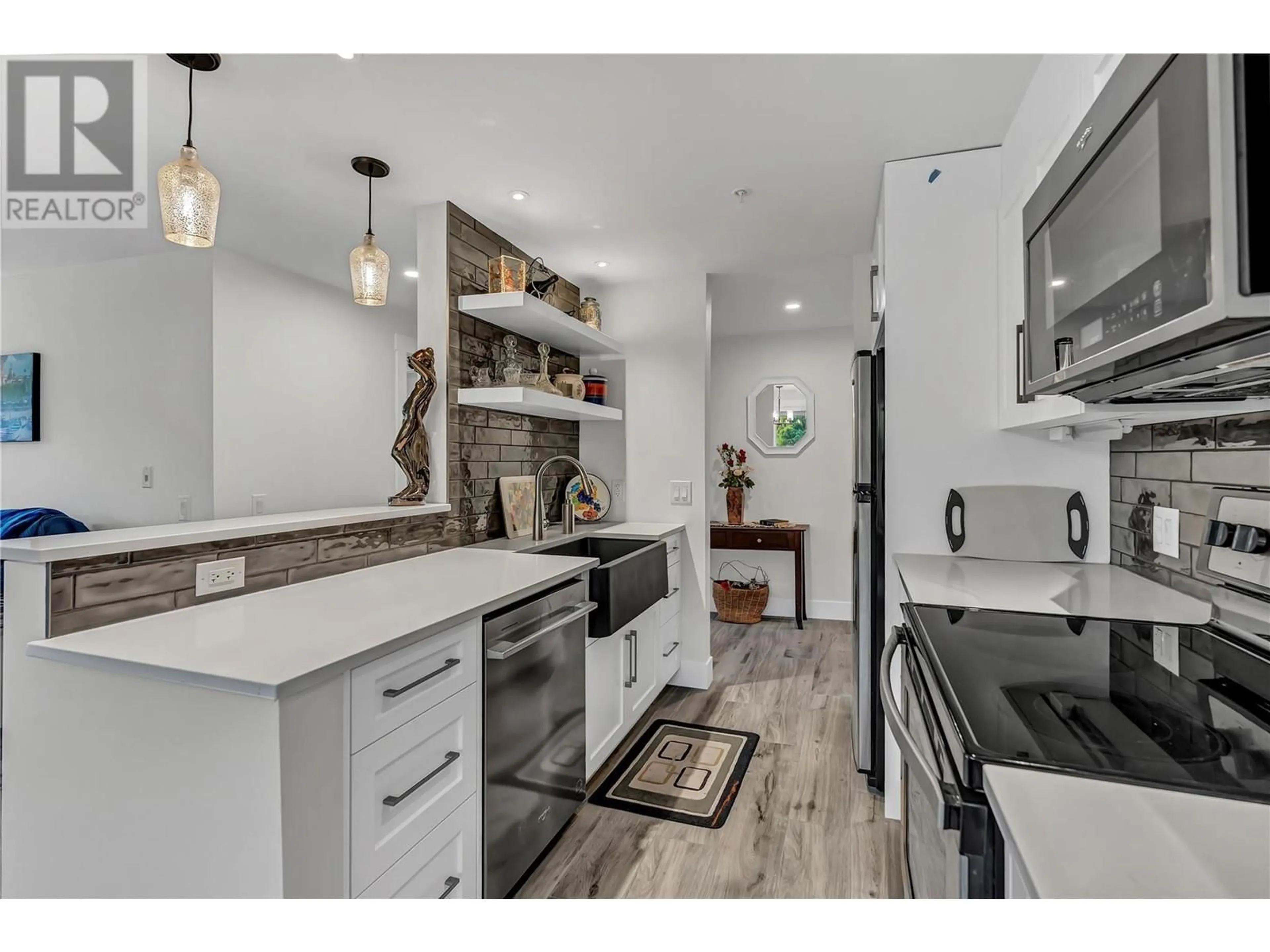 Open concept kitchen, ceramic/tile floor for 105 - 217 ELM AVENUE, Penticton British Columbia V2A3W1