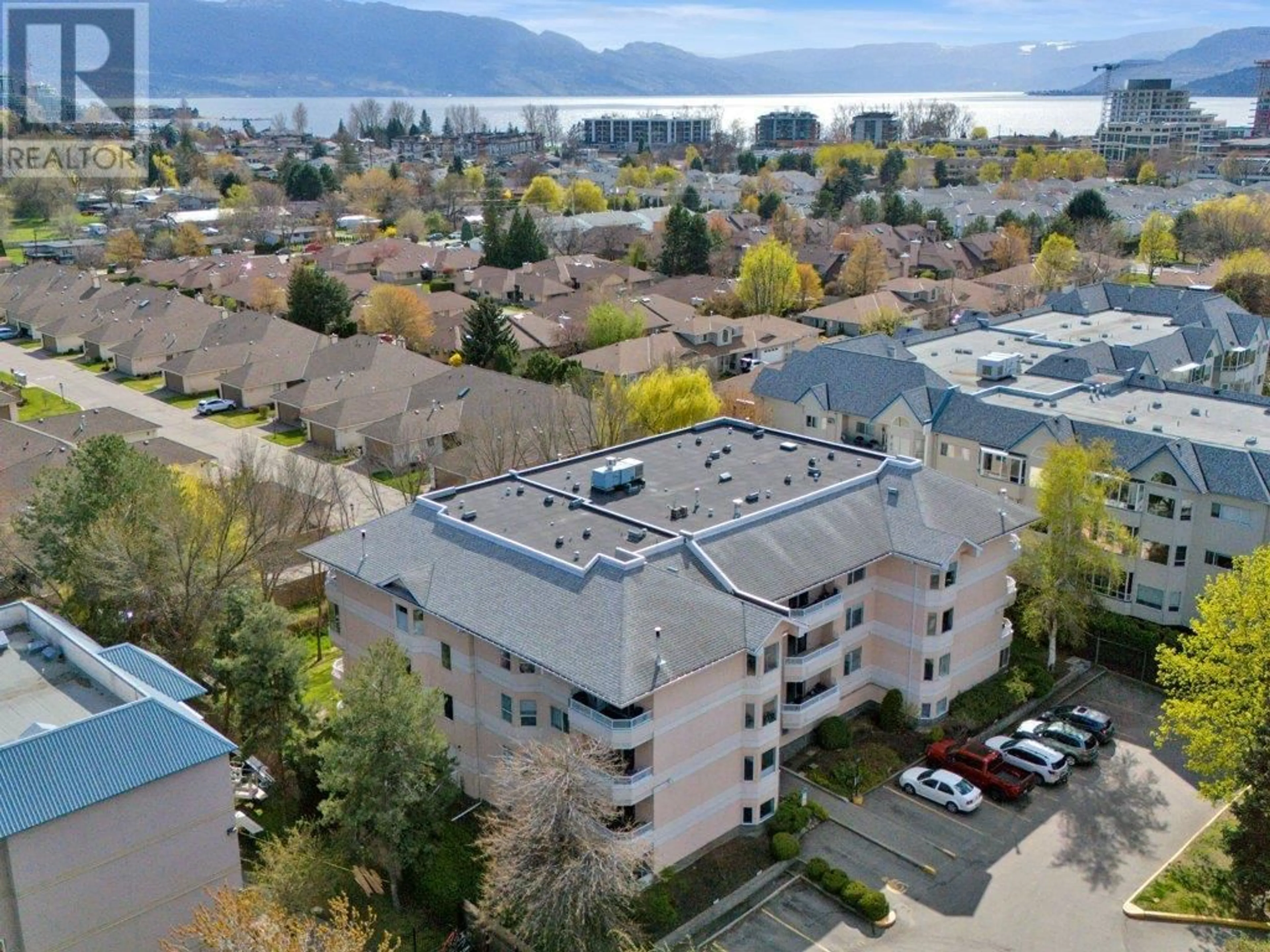 A pic from outside/outdoor area/front of a property/back of a property/a pic from drone, water/lake/river/ocean view for 306 - 987 KLO ROAD, Kelowna British Columbia V1Y9L2