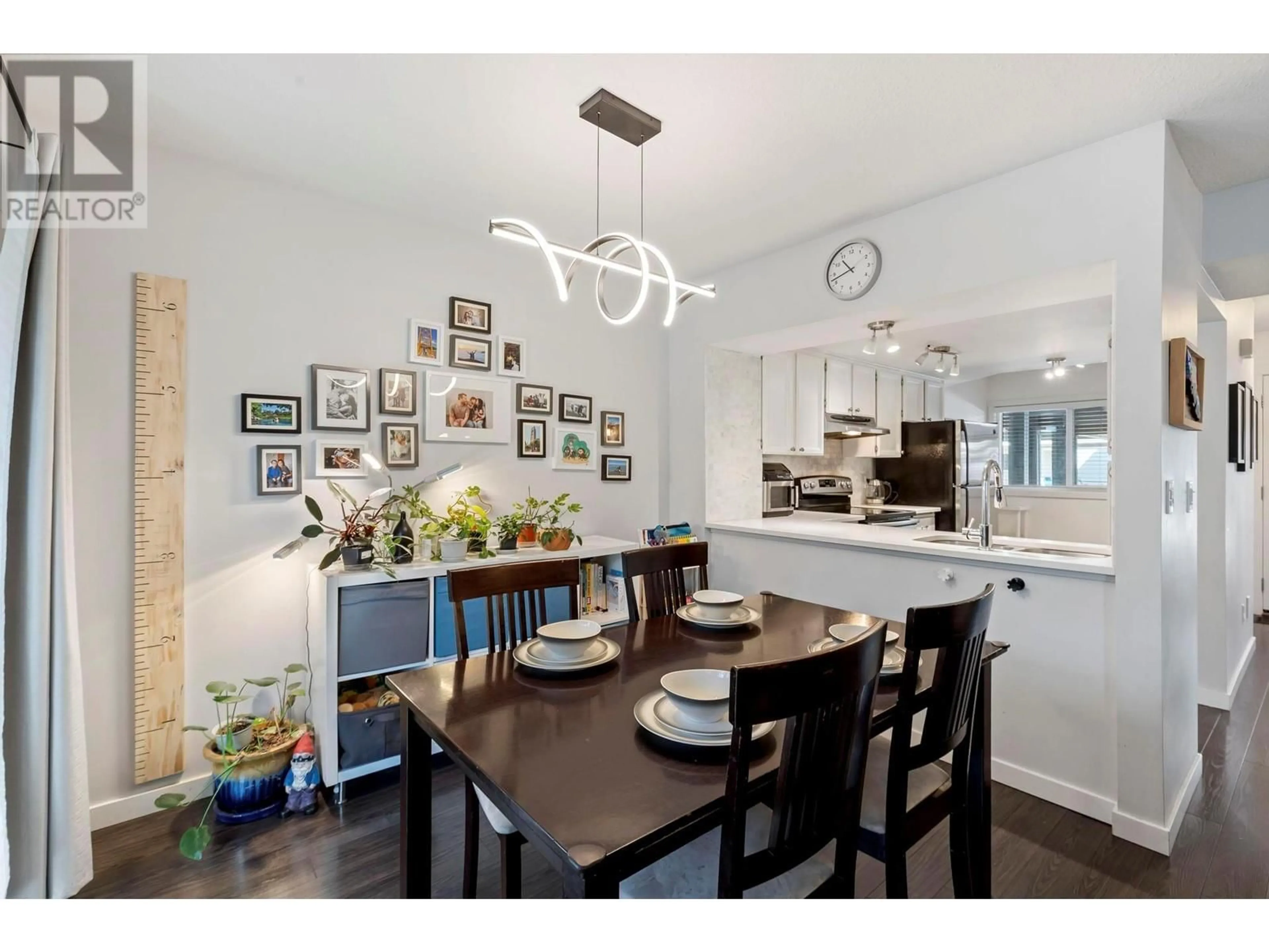 Open concept kitchen, wood/laminate floor for 205 - 2125 BURTCH ROAD, Kelowna British Columbia V1Y8N1