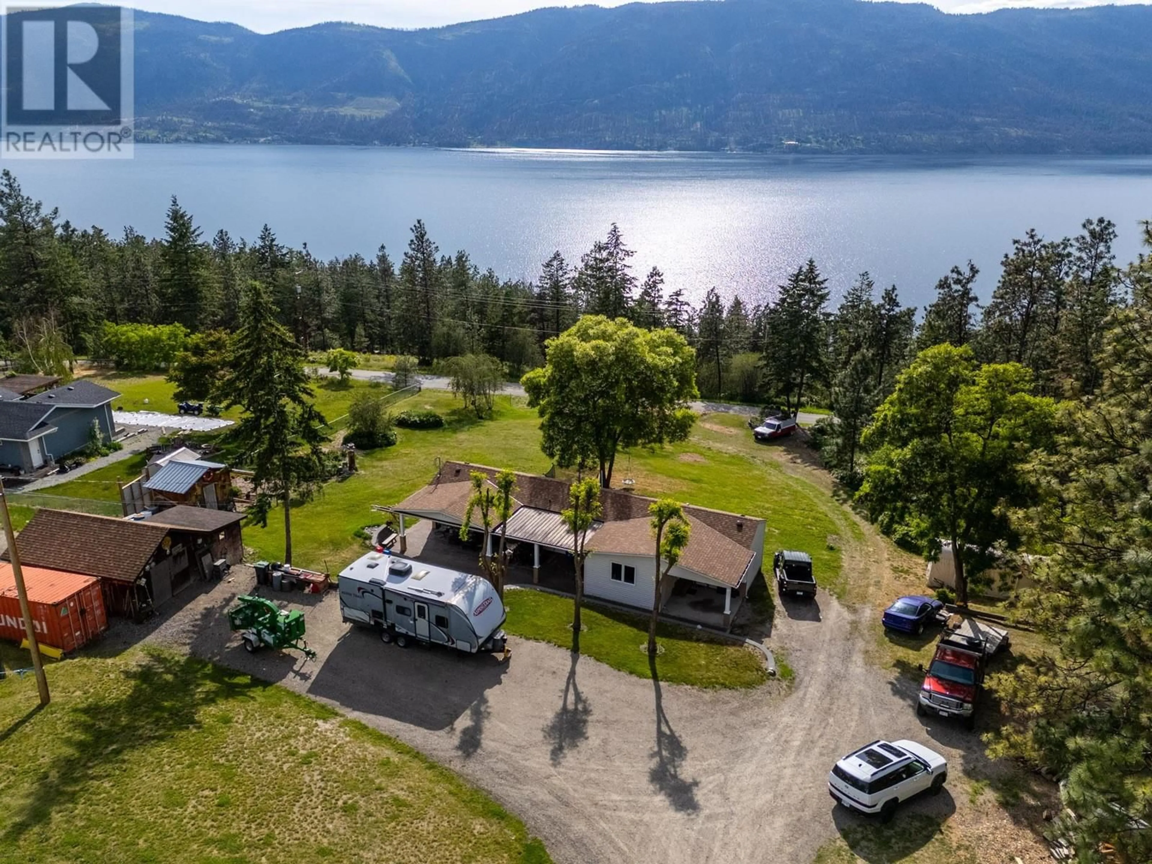 A pic from outside/outdoor area/front of a property/back of a property/a pic from drone, water/lake/river/ocean view for 5574 STUBBS ROAD, Lake Country British Columbia V4V1N1