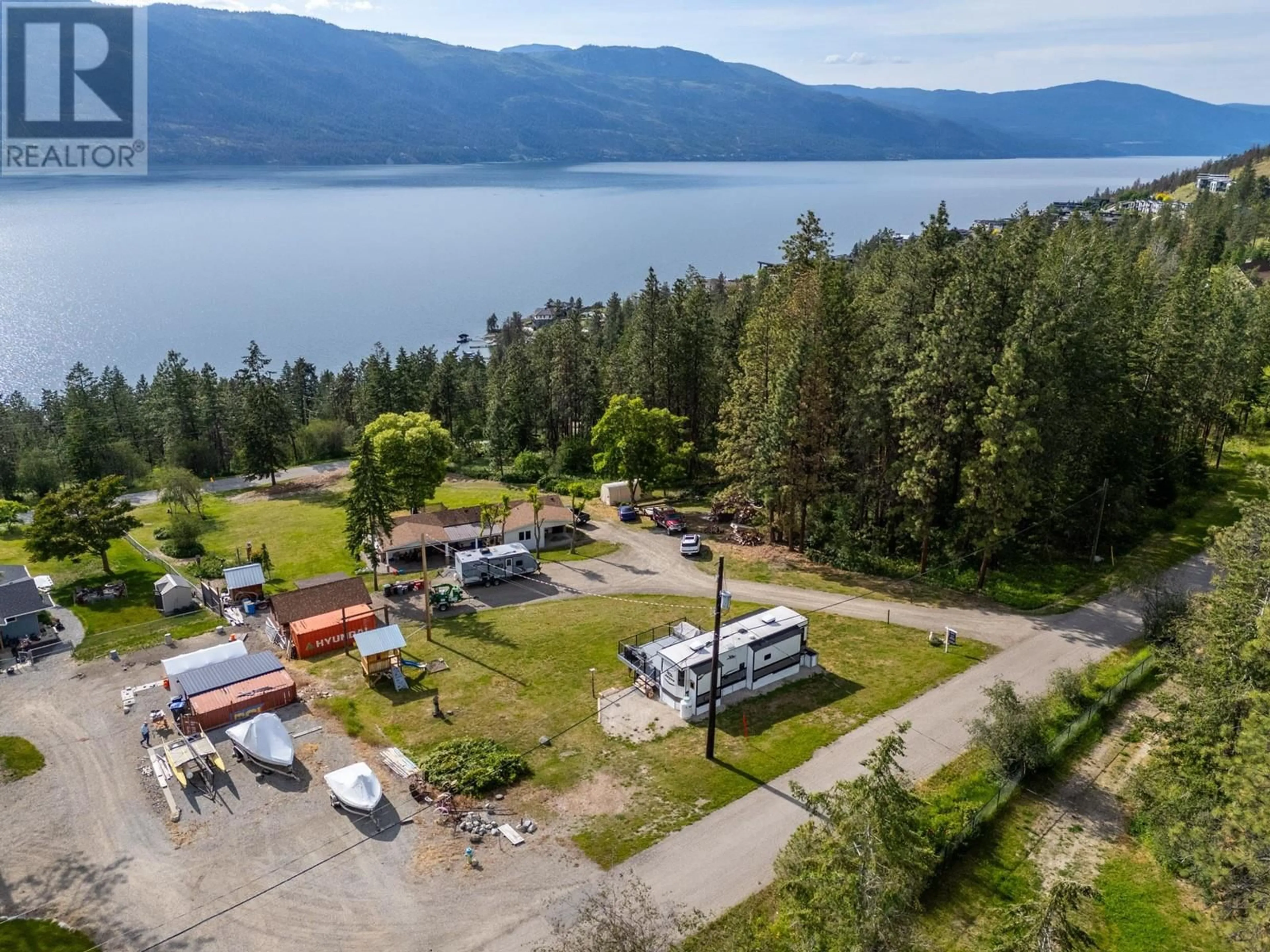 A pic from outside/outdoor area/front of a property/back of a property/a pic from drone, water/lake/river/ocean view for 5574 STUBBS ROAD, Lake Country British Columbia V4V1N1