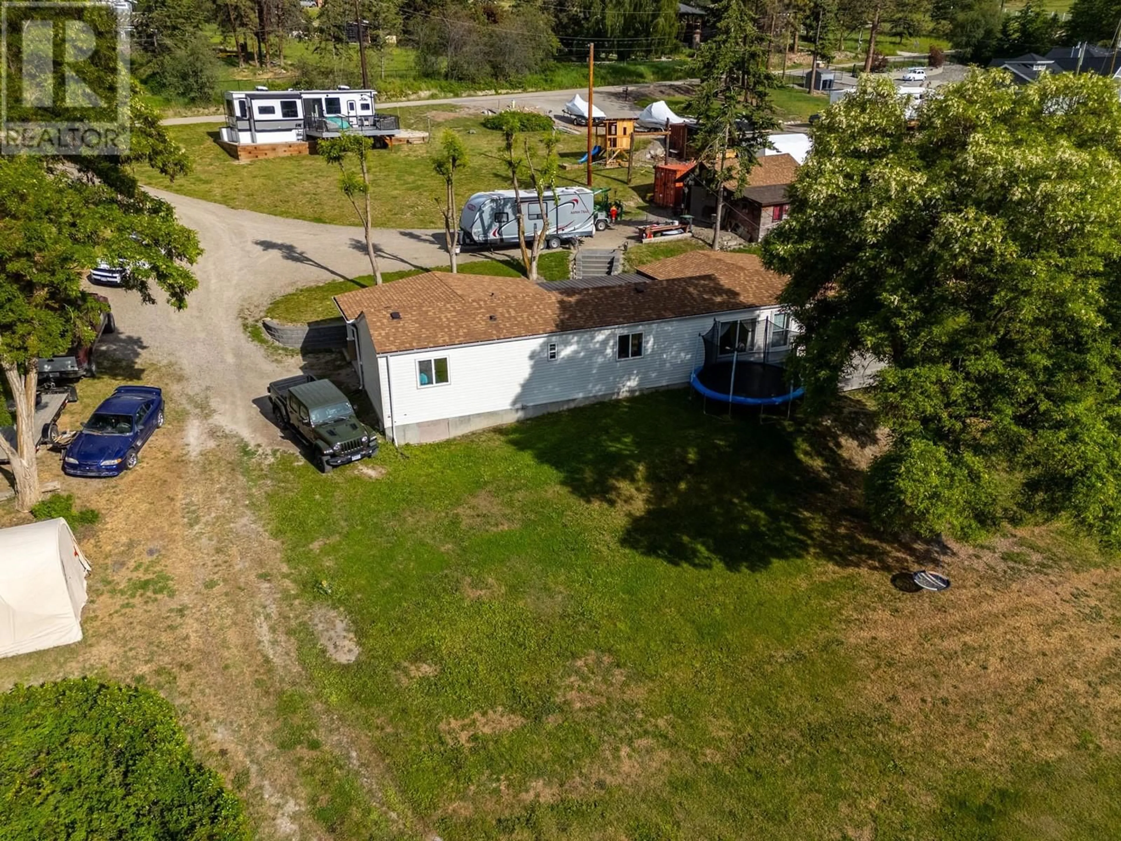A pic from outside/outdoor area/front of a property/back of a property/a pic from drone, street for 5574 STUBBS ROAD, Lake Country British Columbia V4V1N1
