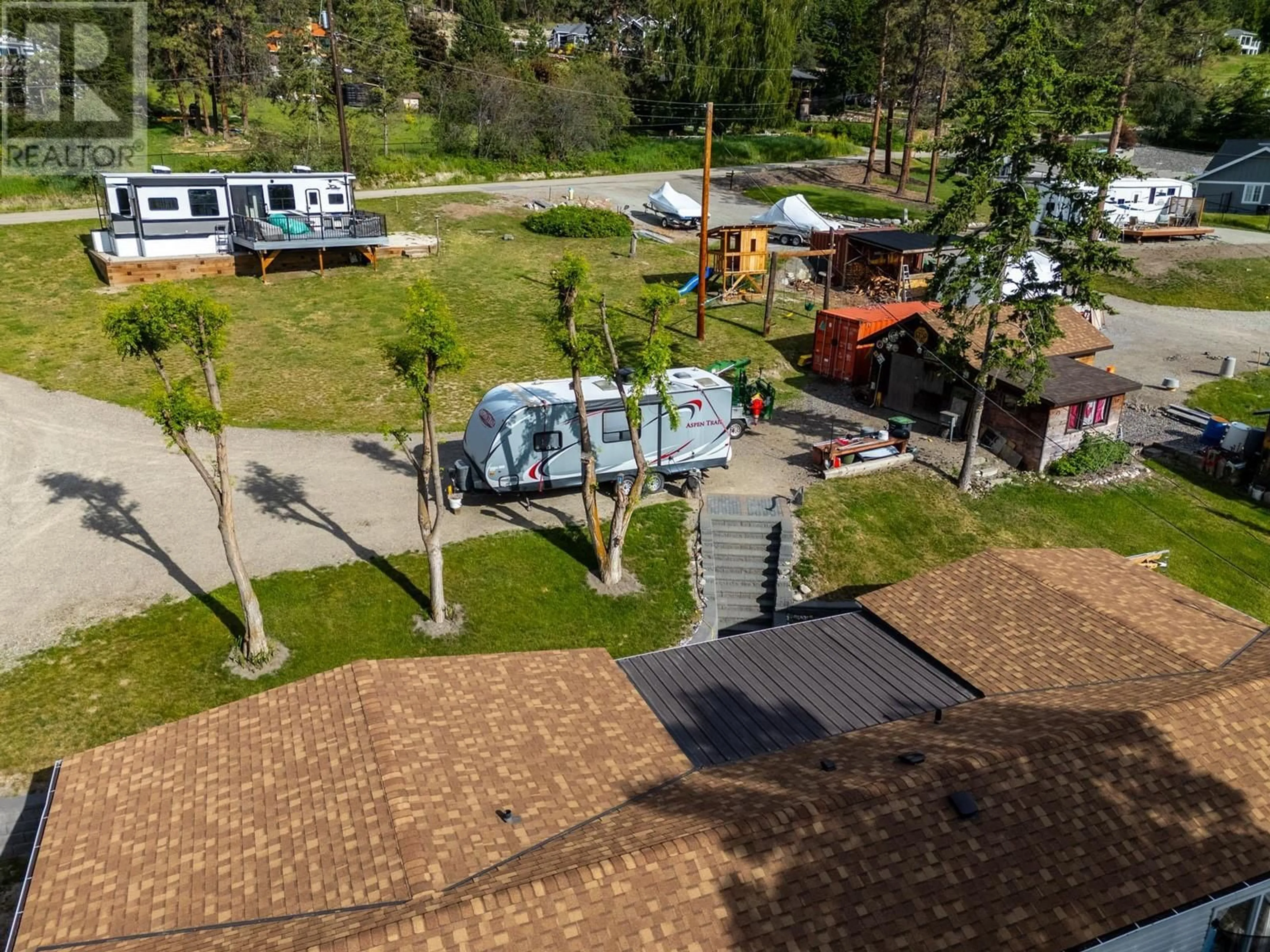 A pic from outside/outdoor area/front of a property/back of a property/a pic from drone, street for 5574 STUBBS ROAD, Lake Country British Columbia V4V1N1