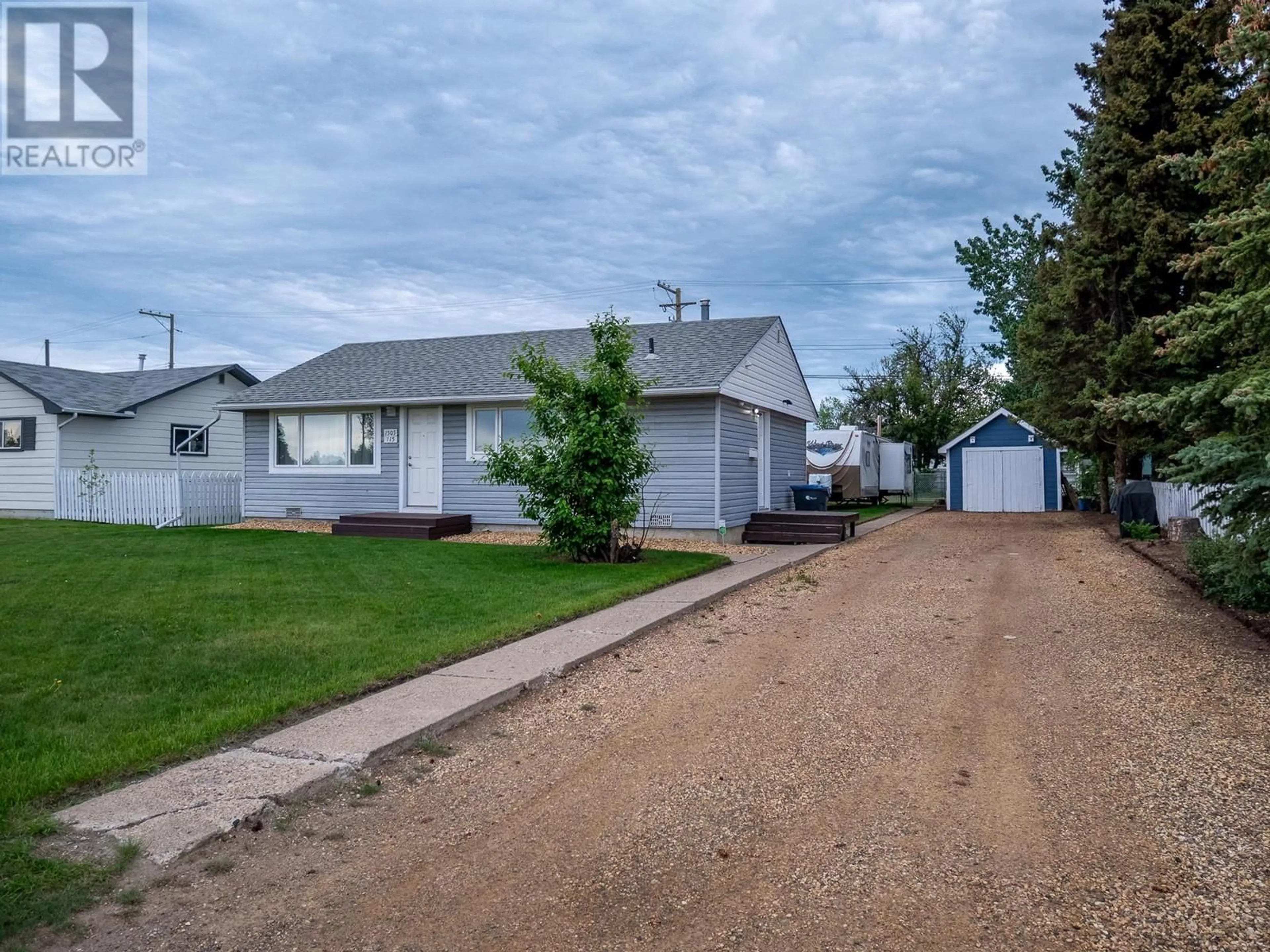 A pic from outside/outdoor area/front of a property/back of a property/a pic from drone, street for 1505 115 AVENUE, Dawson Creek British Columbia V1G3C6