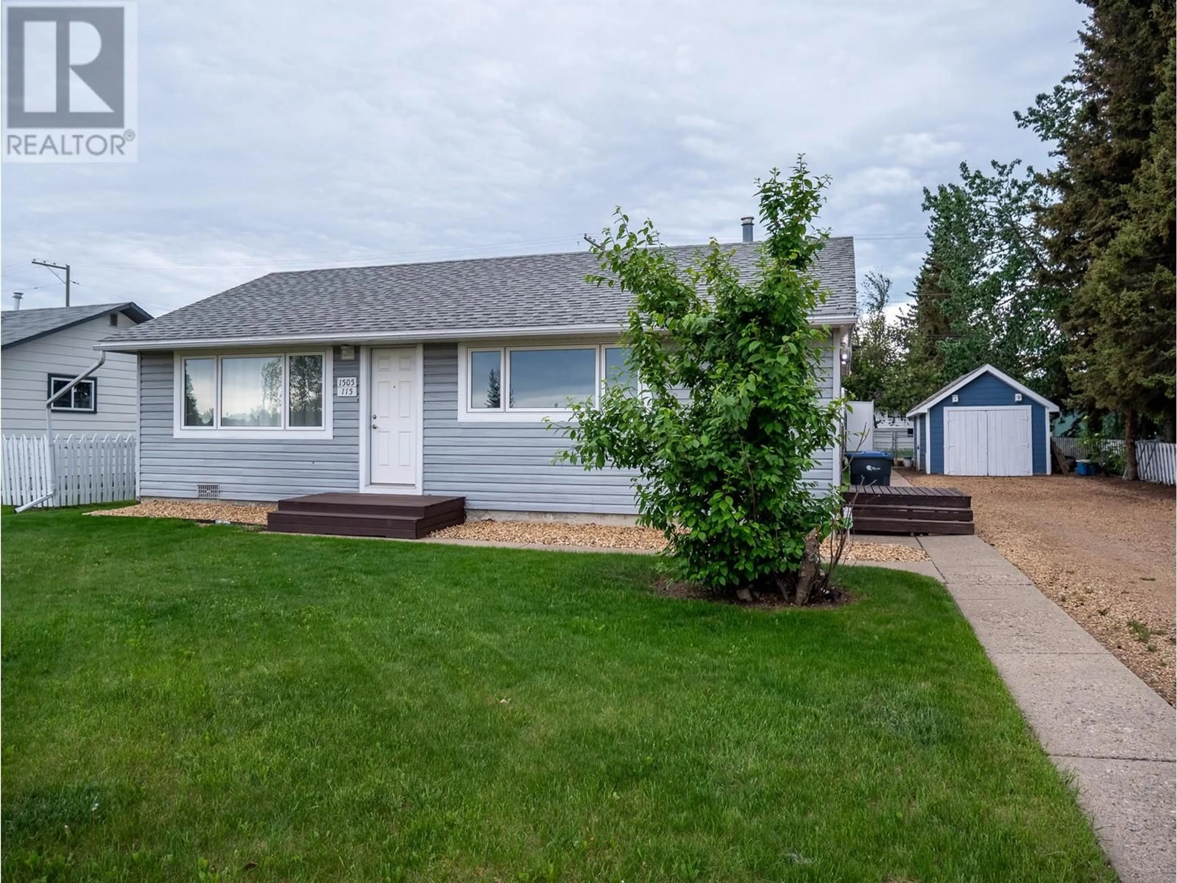 Home with vinyl exterior material, street for 1505 115 AVENUE, Dawson Creek British Columbia V1G3C6