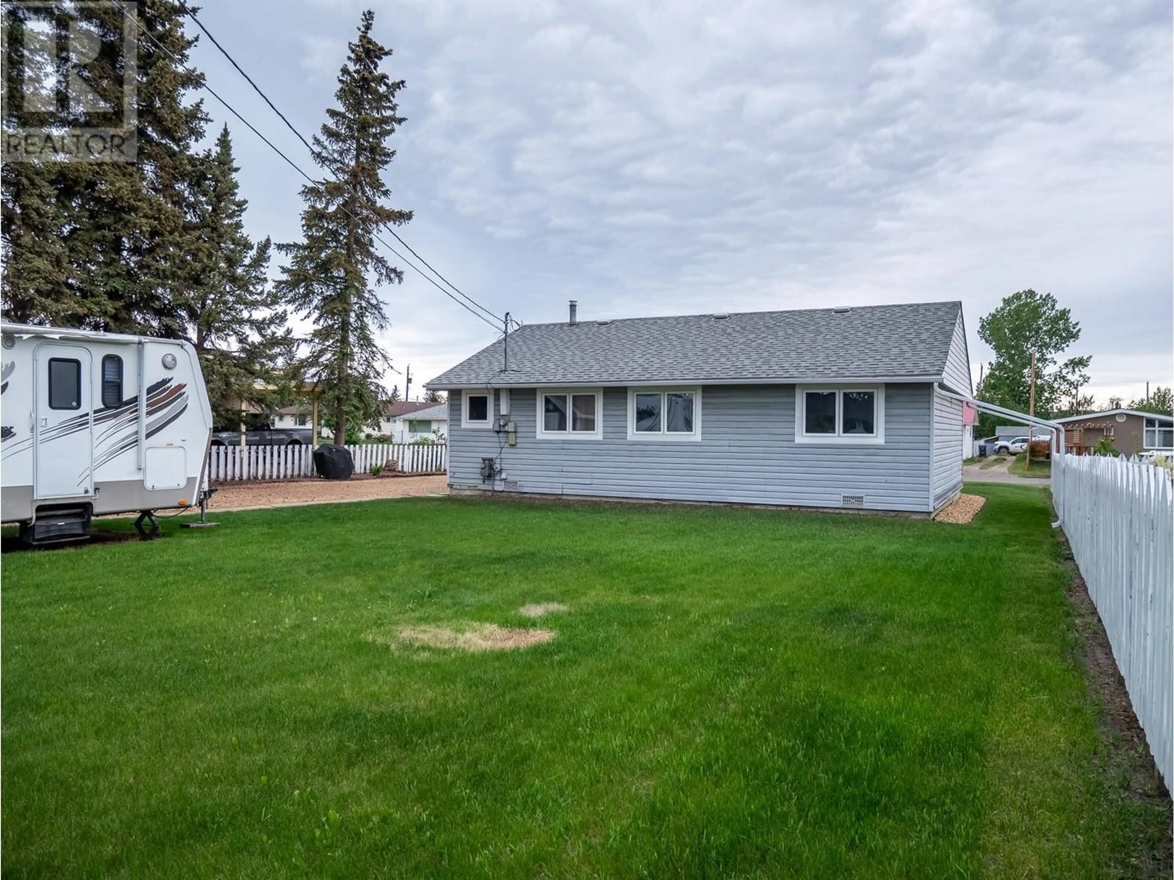 A pic from outside/outdoor area/front of a property/back of a property/a pic from drone, street for 1505 115 AVENUE, Dawson Creek British Columbia V1G3C6
