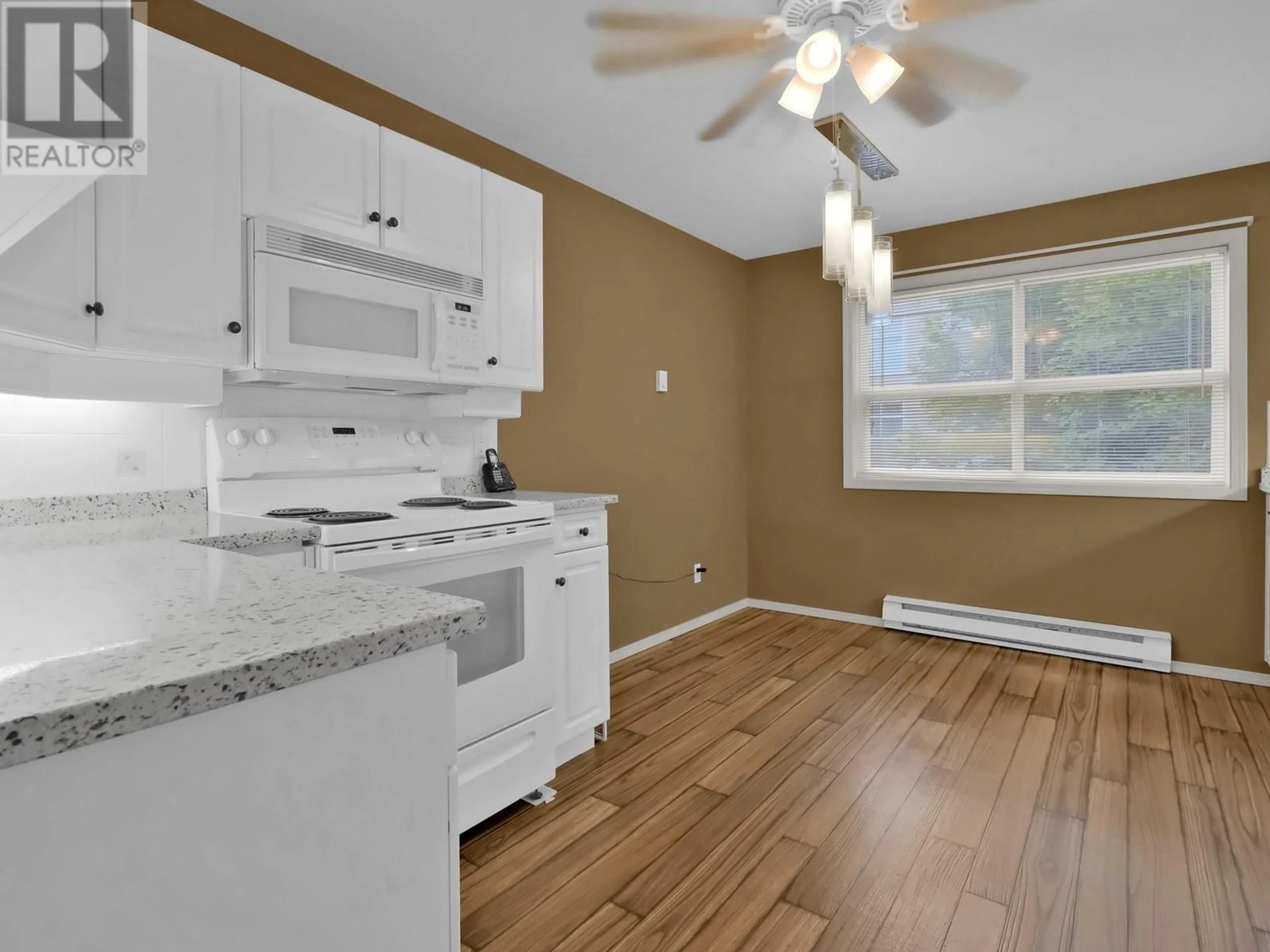 Standard kitchen, wood/laminate floor for 218 - 555 HOUGHTON ROAD, Kelowna British Columbia V1Y7P9