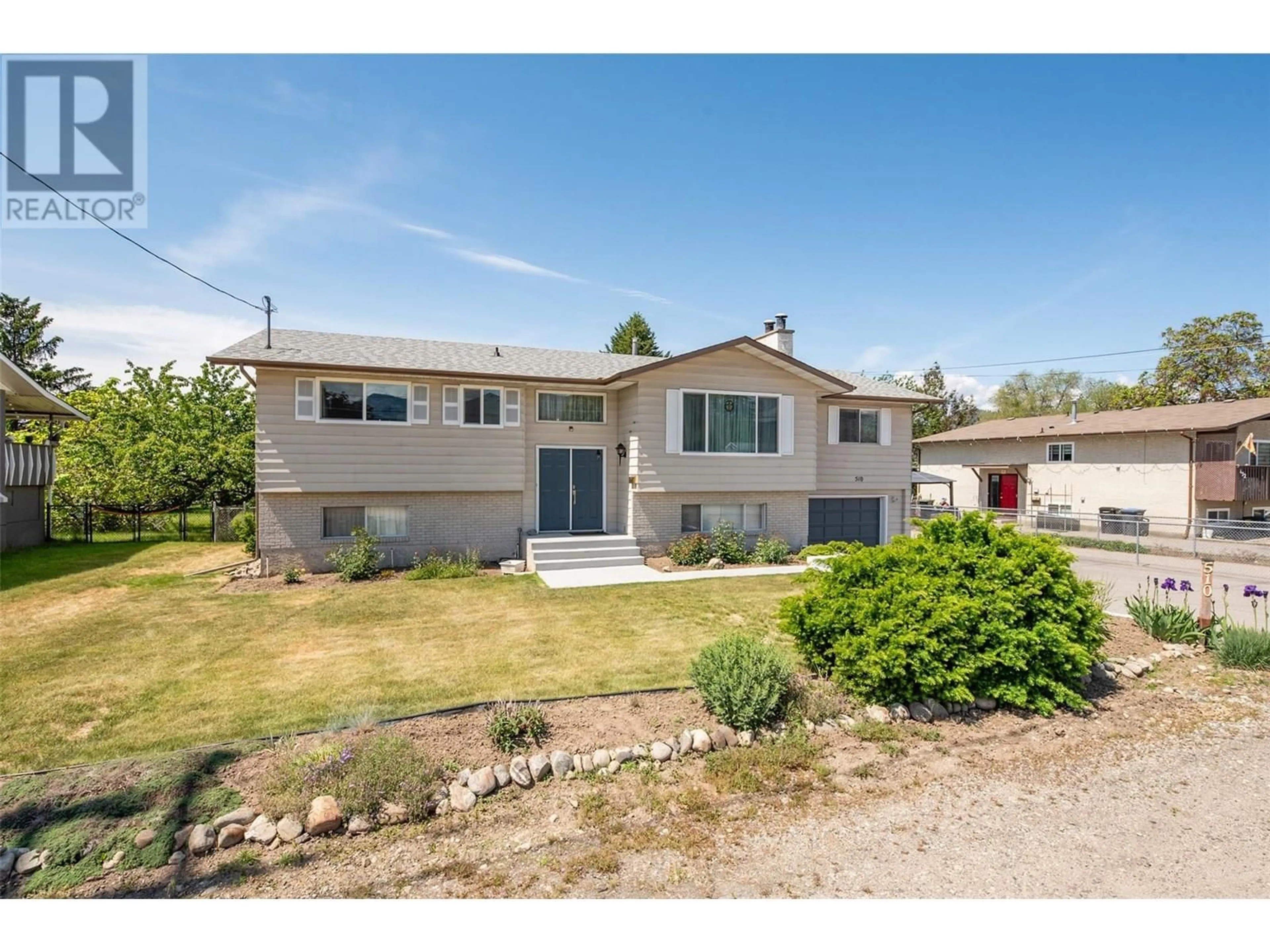 Home with vinyl exterior material, street for 510 GERSTMAR ROAD, Kelowna British Columbia V1X4B1