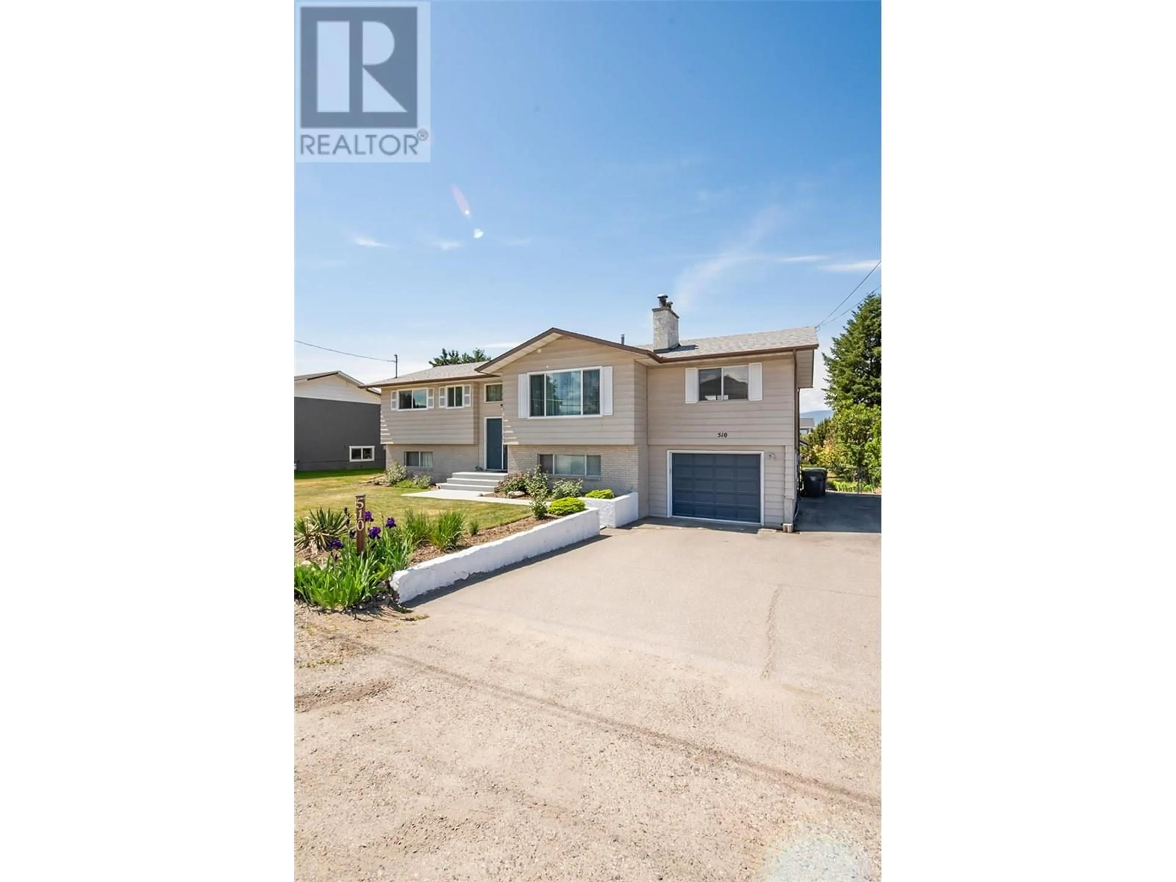 A pic from outside/outdoor area/front of a property/back of a property/a pic from drone, street for 510 GERSTMAR ROAD, Kelowna British Columbia V1X4B1