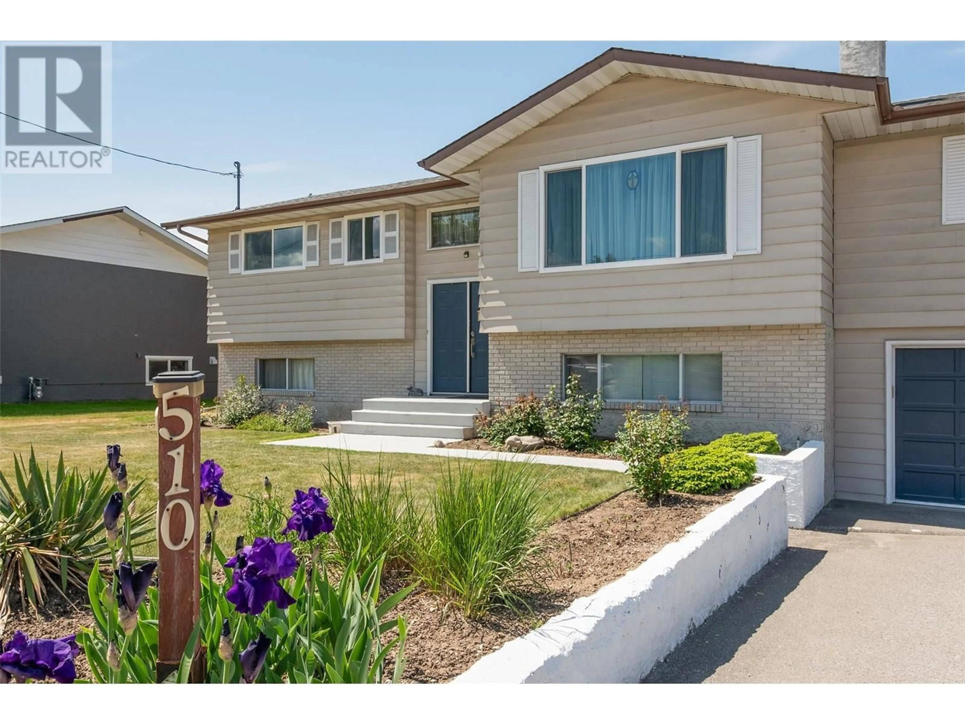 Home with vinyl exterior material, street for 510 GERSTMAR ROAD, Kelowna British Columbia V1X4B1