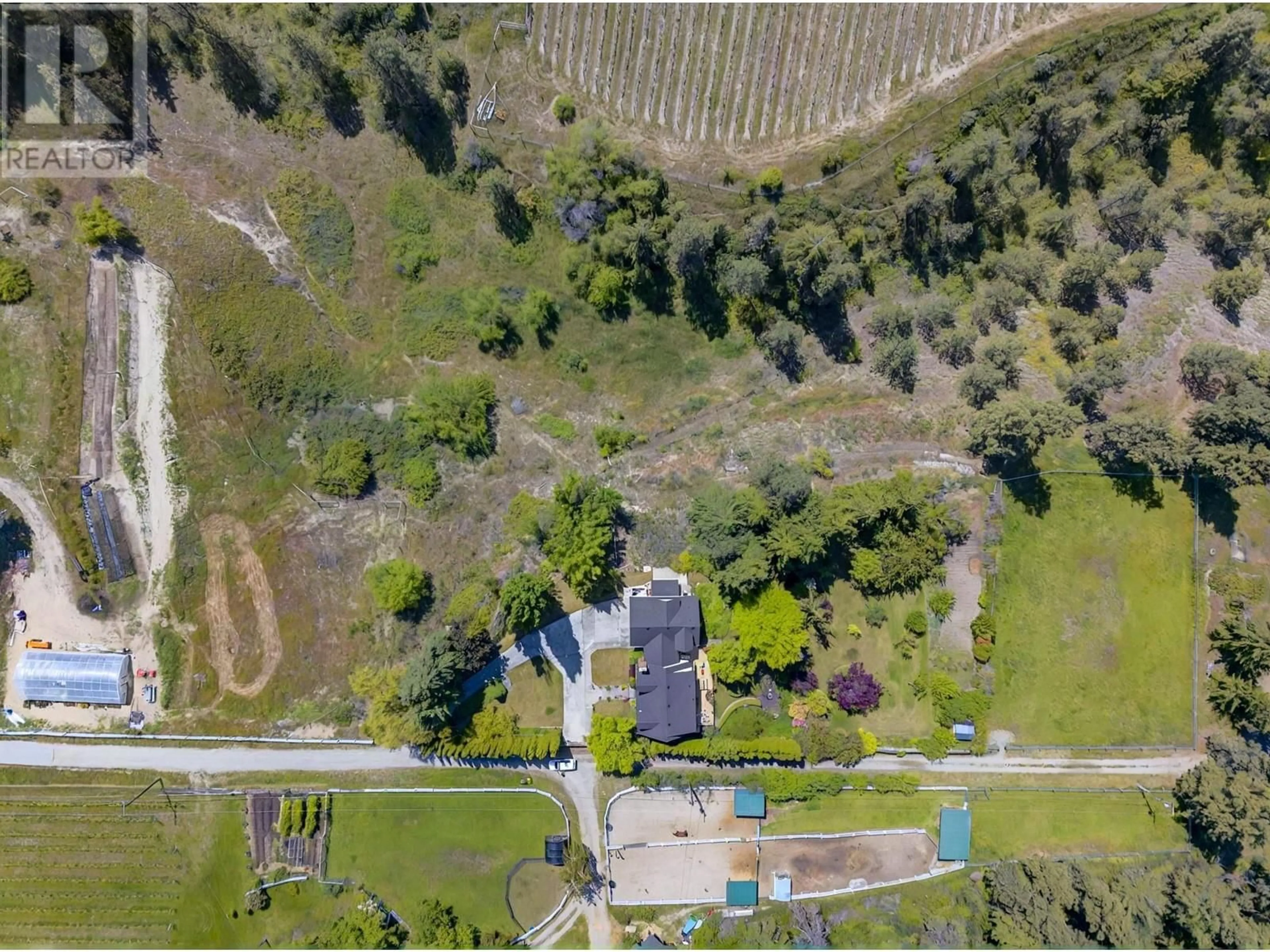 A pic from outside/outdoor area/front of a property/back of a property/a pic from drone, street for 3025 NARAMATA ROAD, Naramata British Columbia V0H1N1