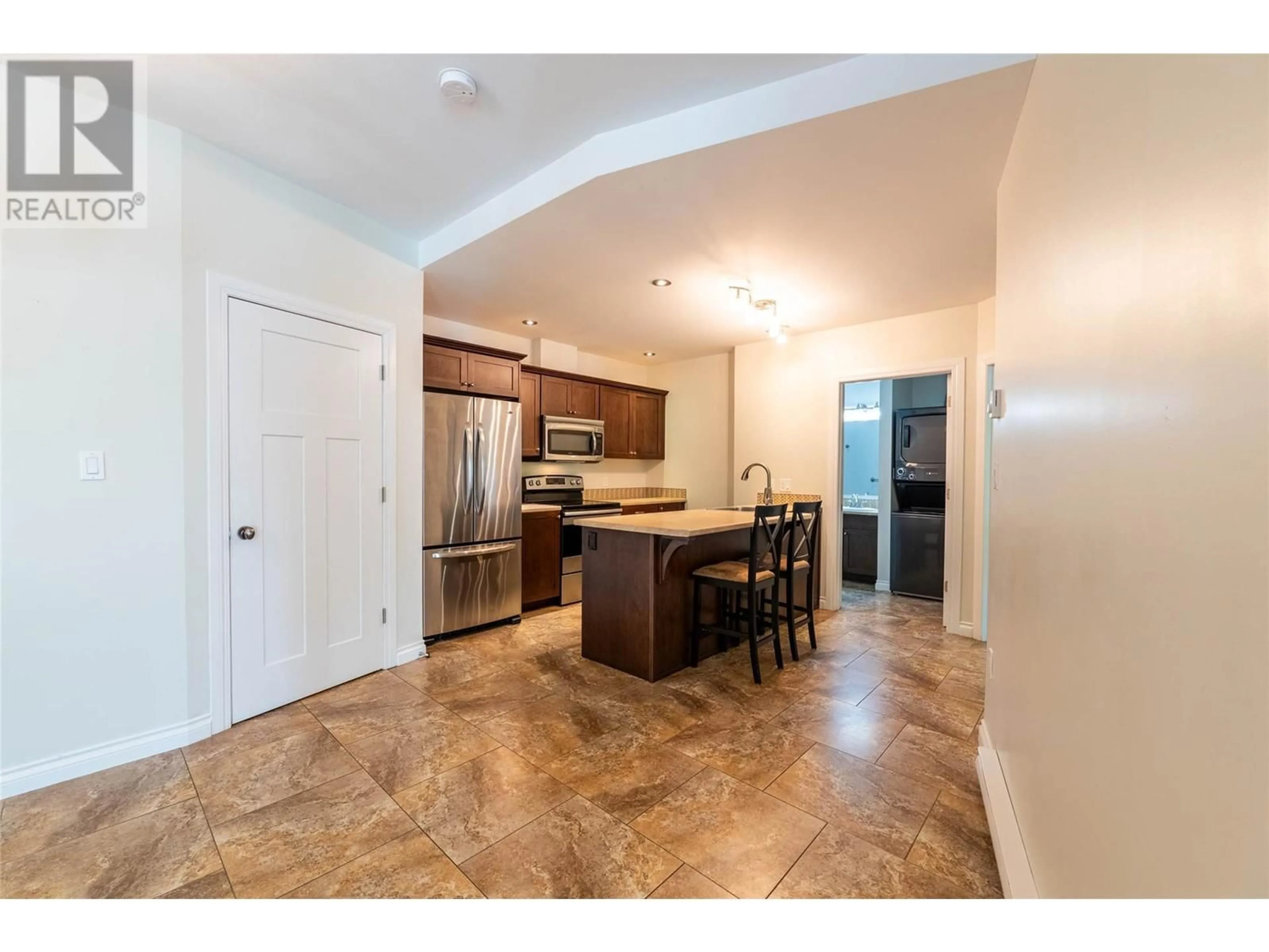 Open concept kitchen, ceramic/tile floor for 102 - 2011 PERRIER ROAD, Nelson British Columbia V1L6Y8