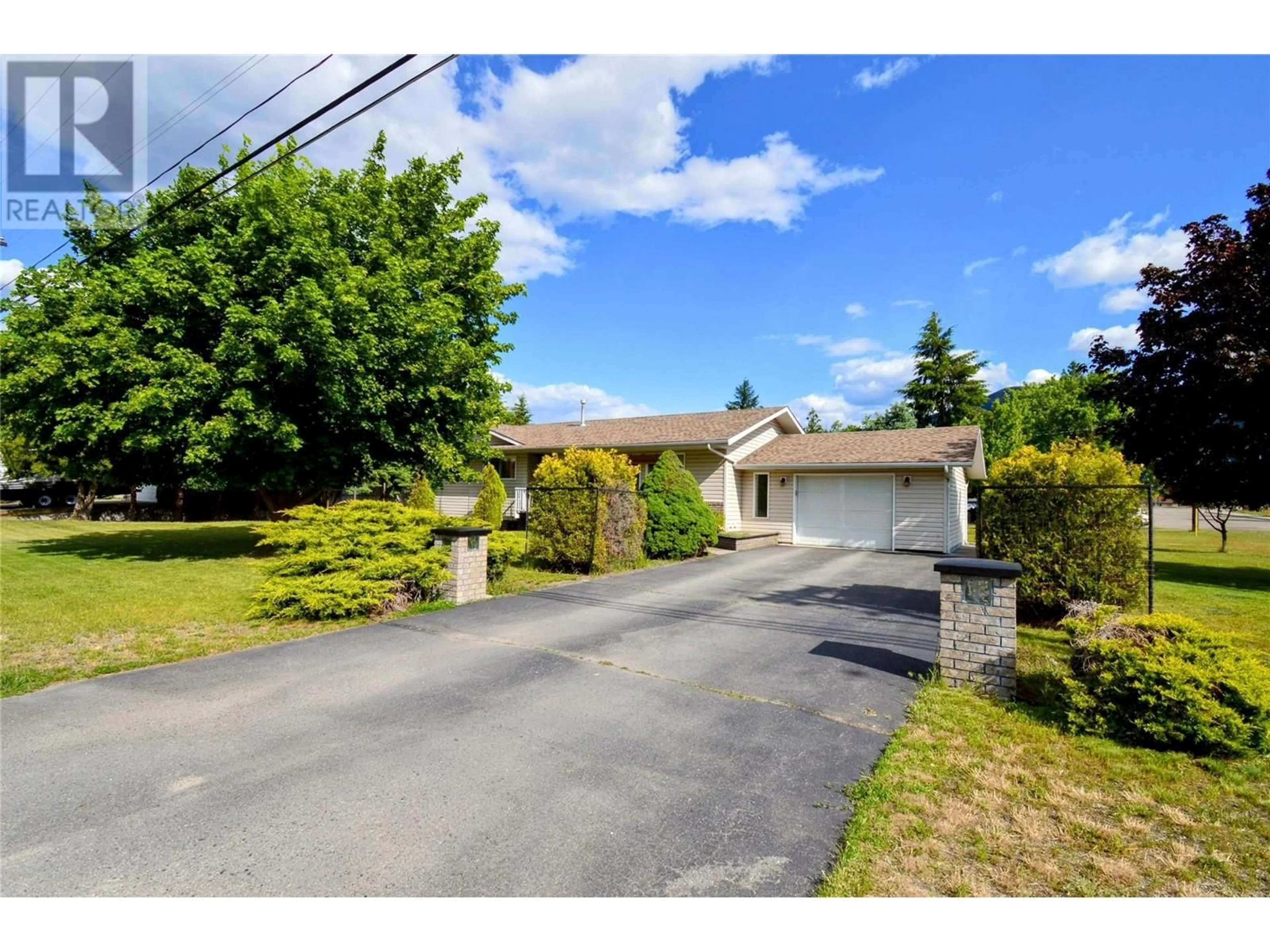A pic from outside/outdoor area/front of a property/back of a property/a pic from drone, street for 2480 75TH AVENUE, Grand Forks British Columbia V0H1H2